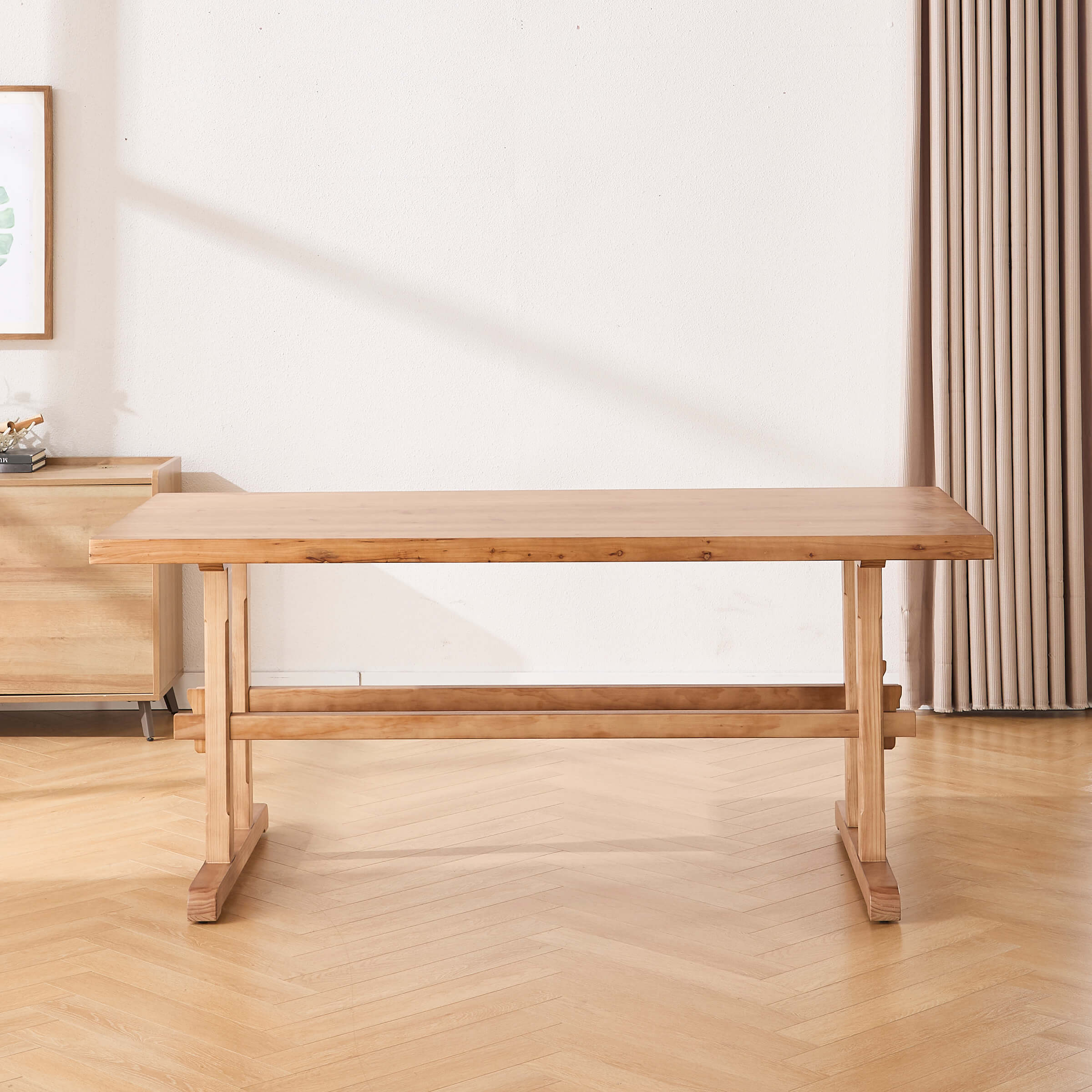 Wood dining table from the side showing long rectangular top and sturdy legs
