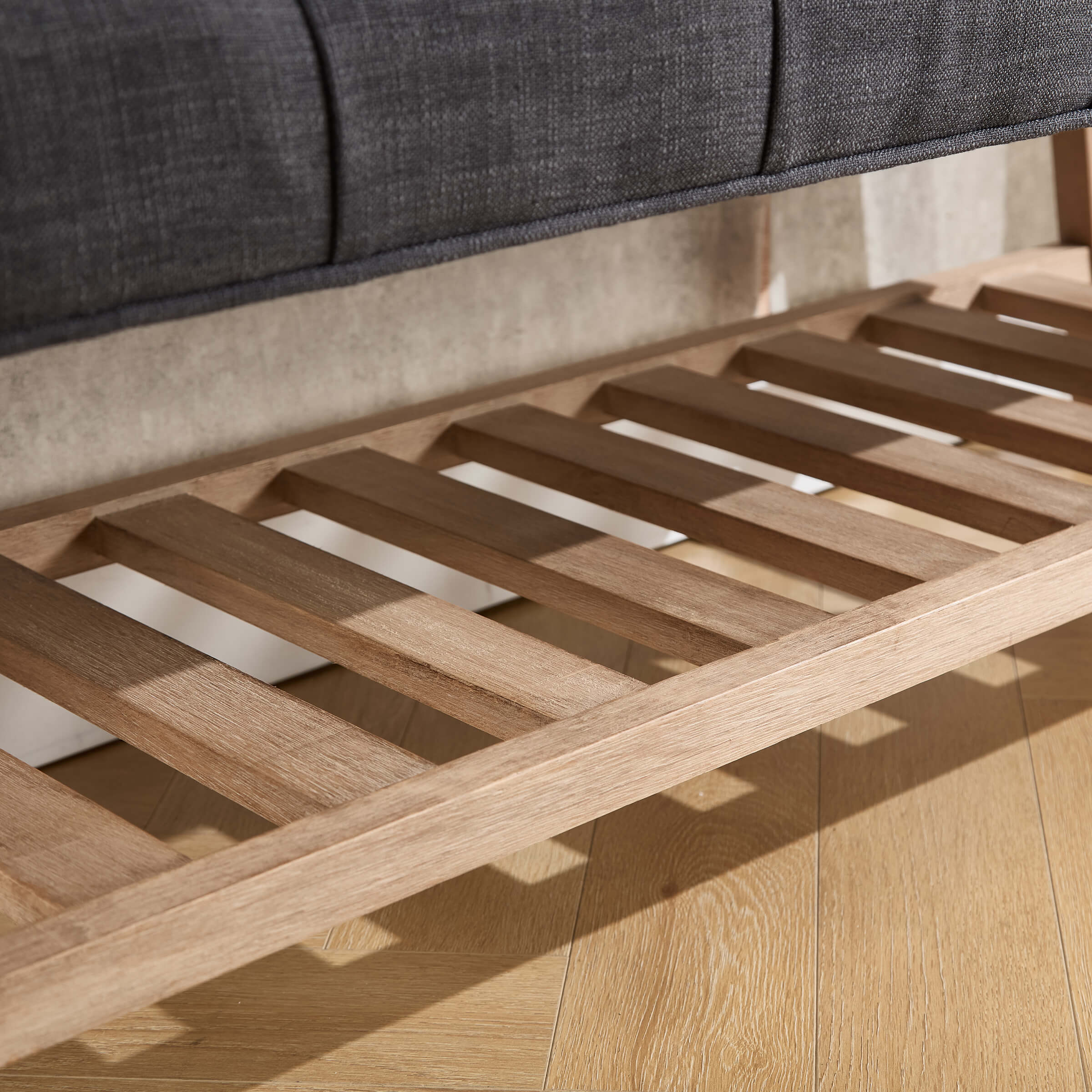 Under-seat slatted shelf close-up
