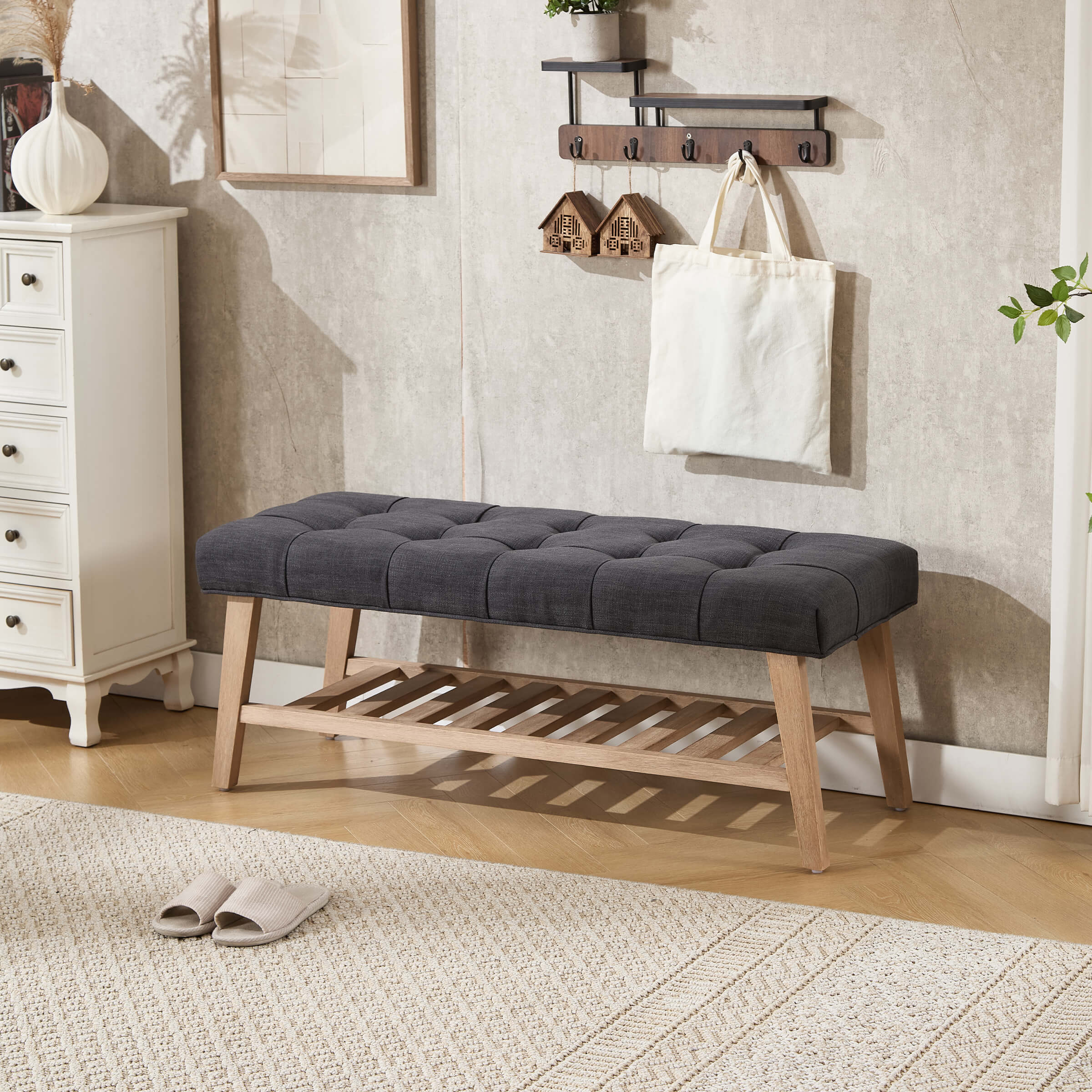 Bench with dark gray tufted cushion