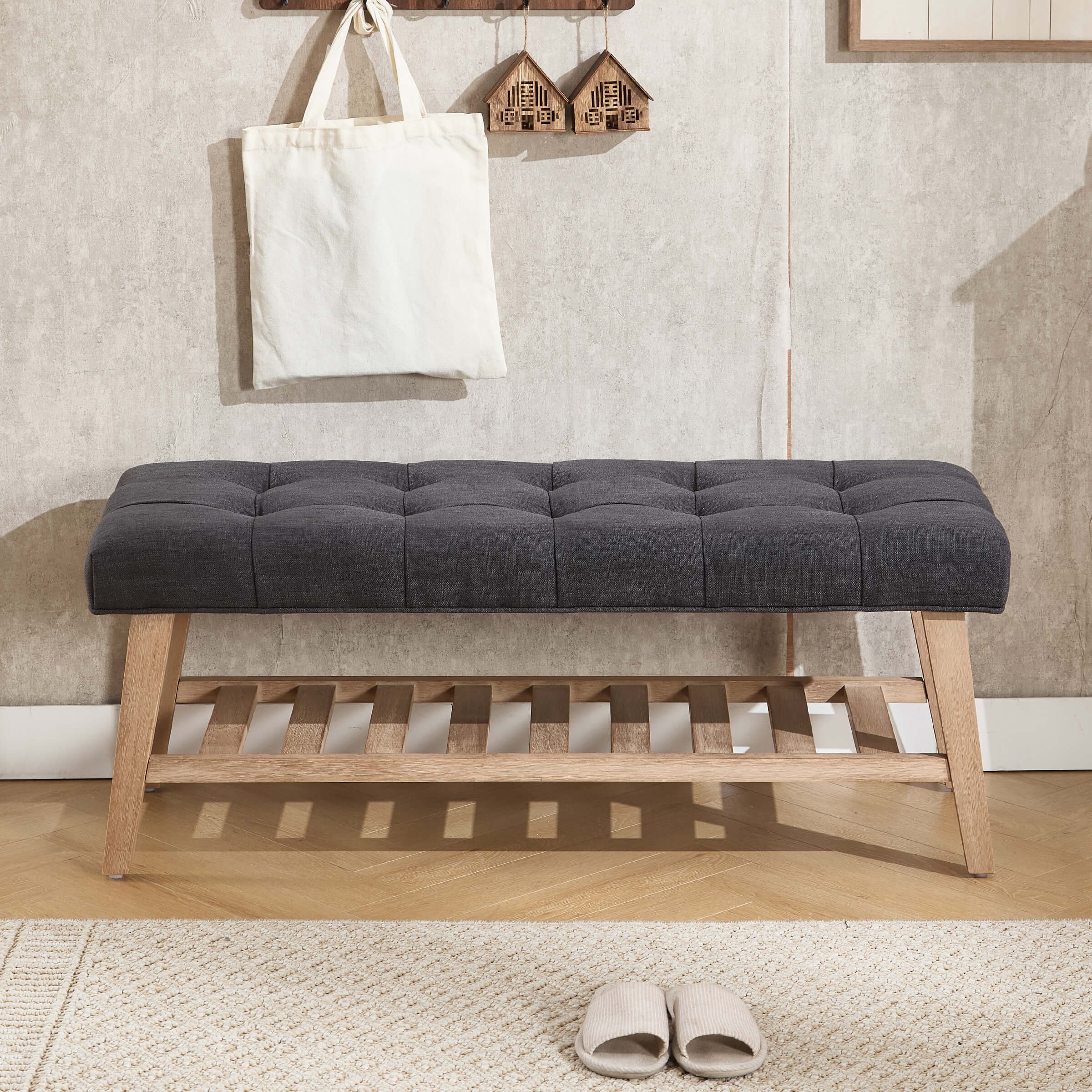 Bench with dark gray tufted cushion