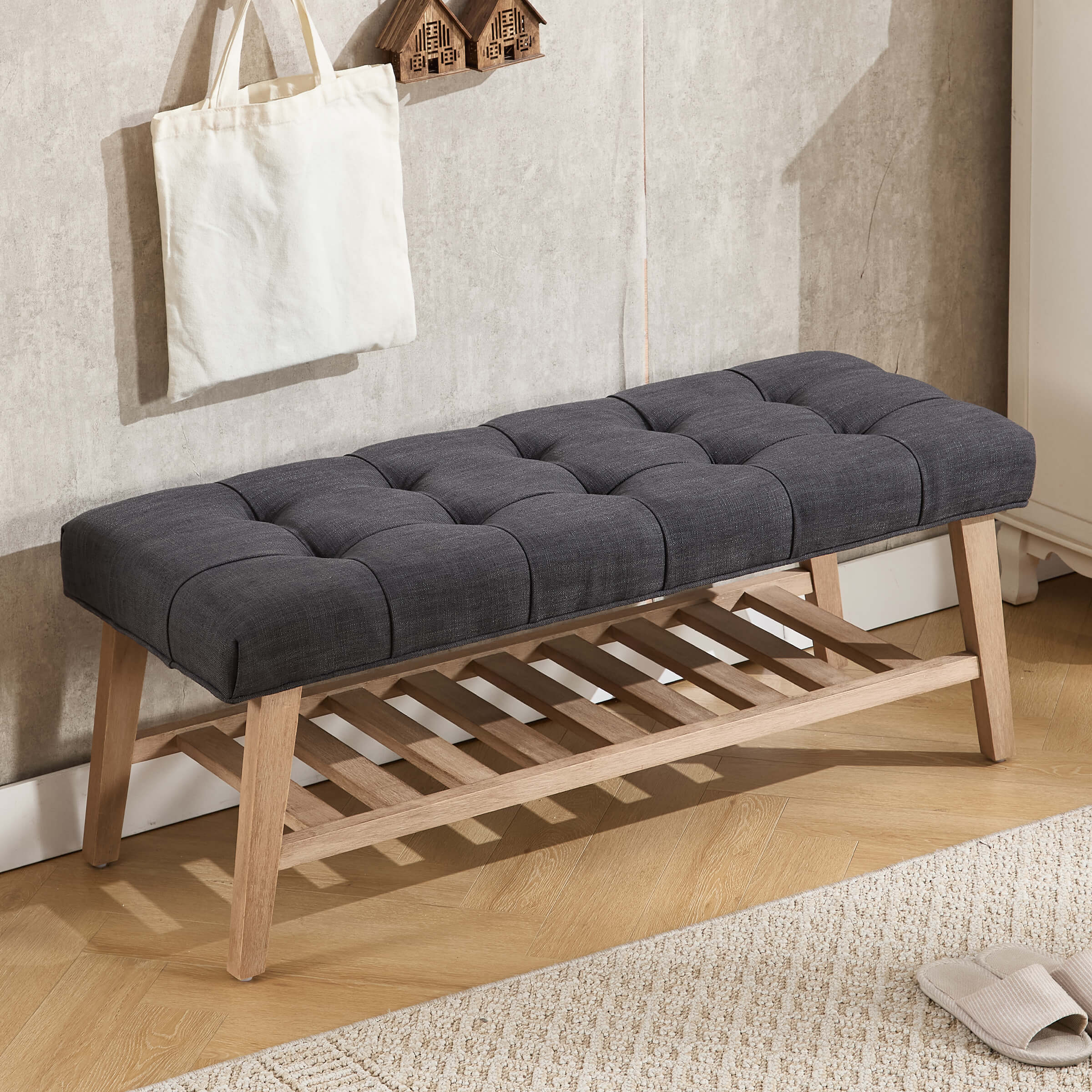 Bench with dark gray tufted cushion