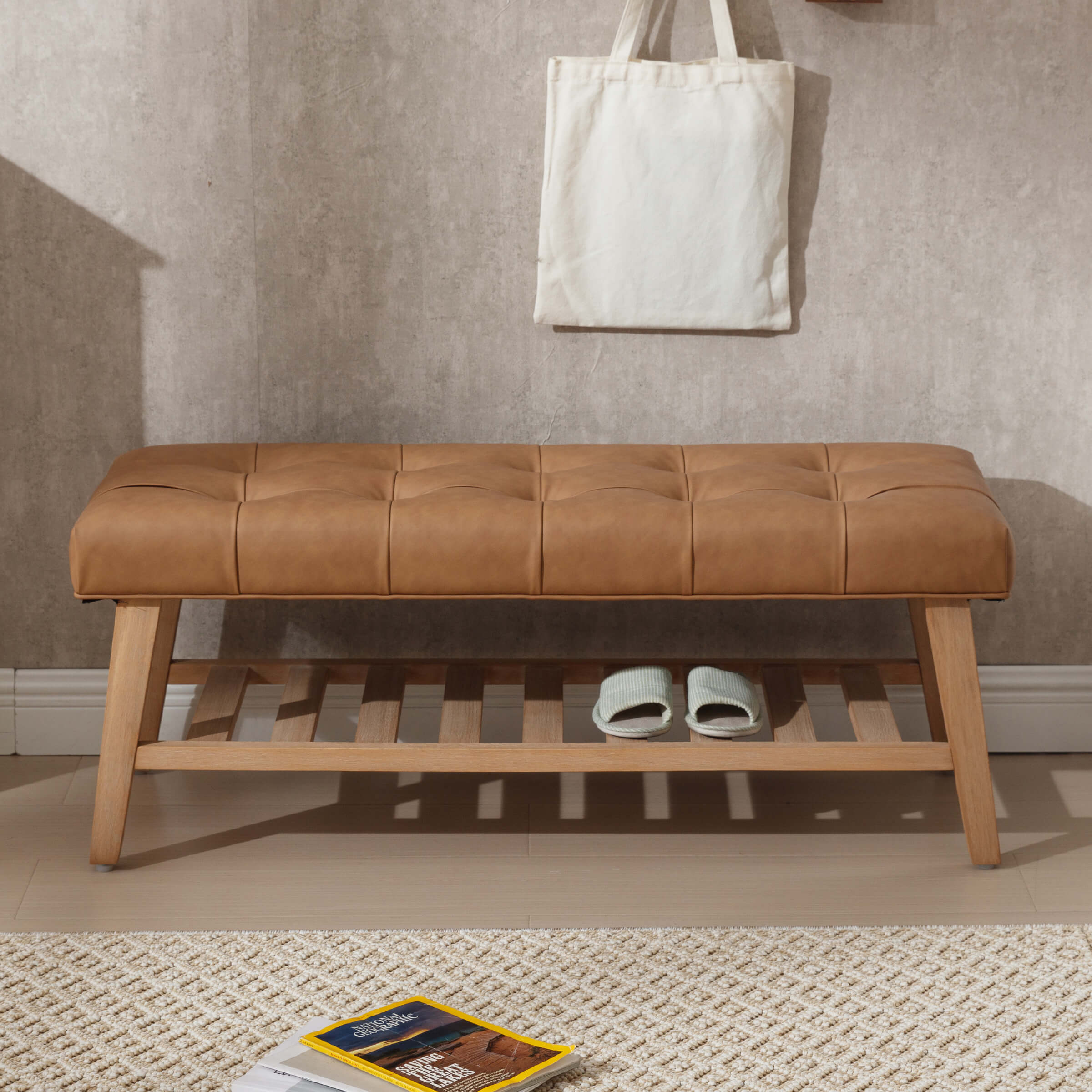 Bench with tan leather tufted cushion