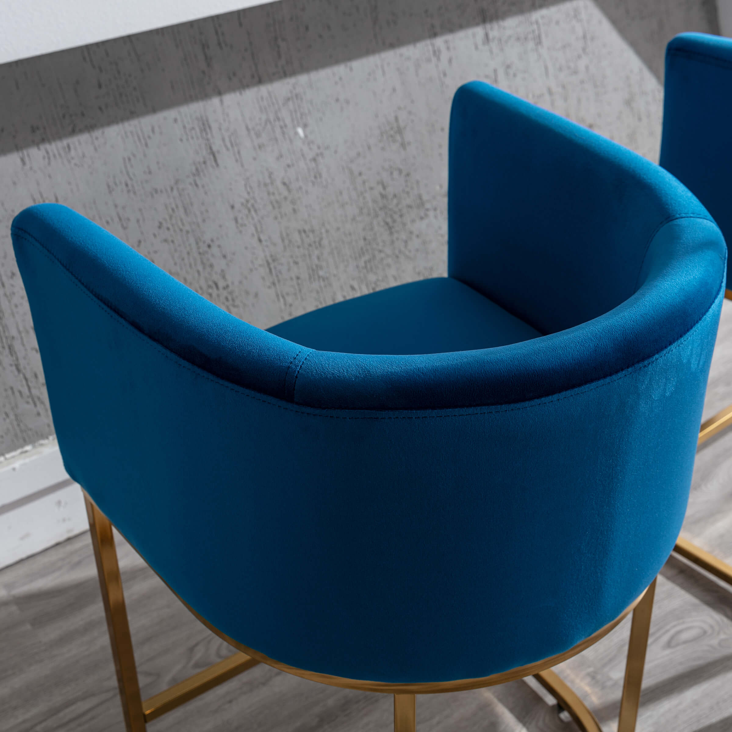 Blue velvet chair from back/side