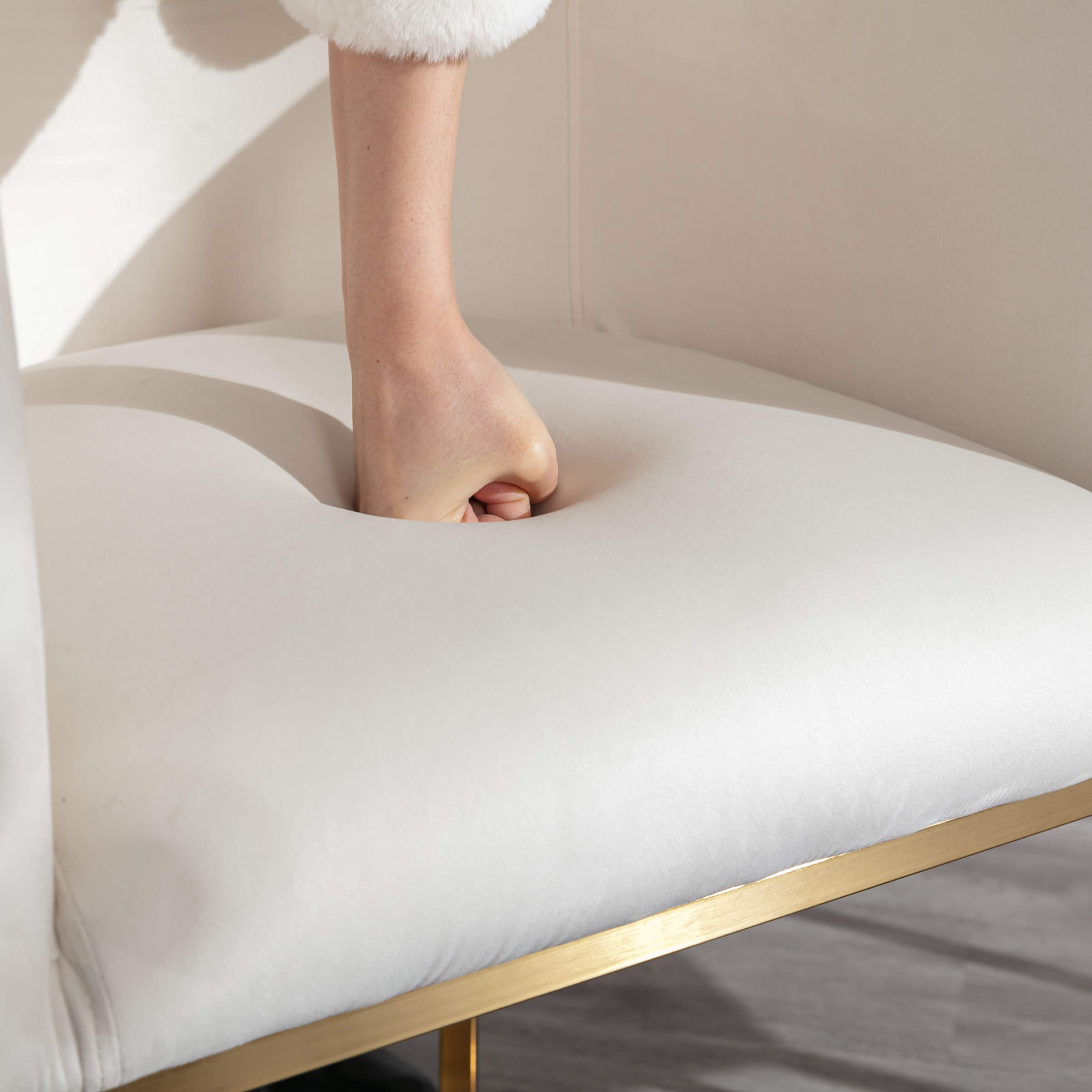 Close-up of seat tuft area being pressed