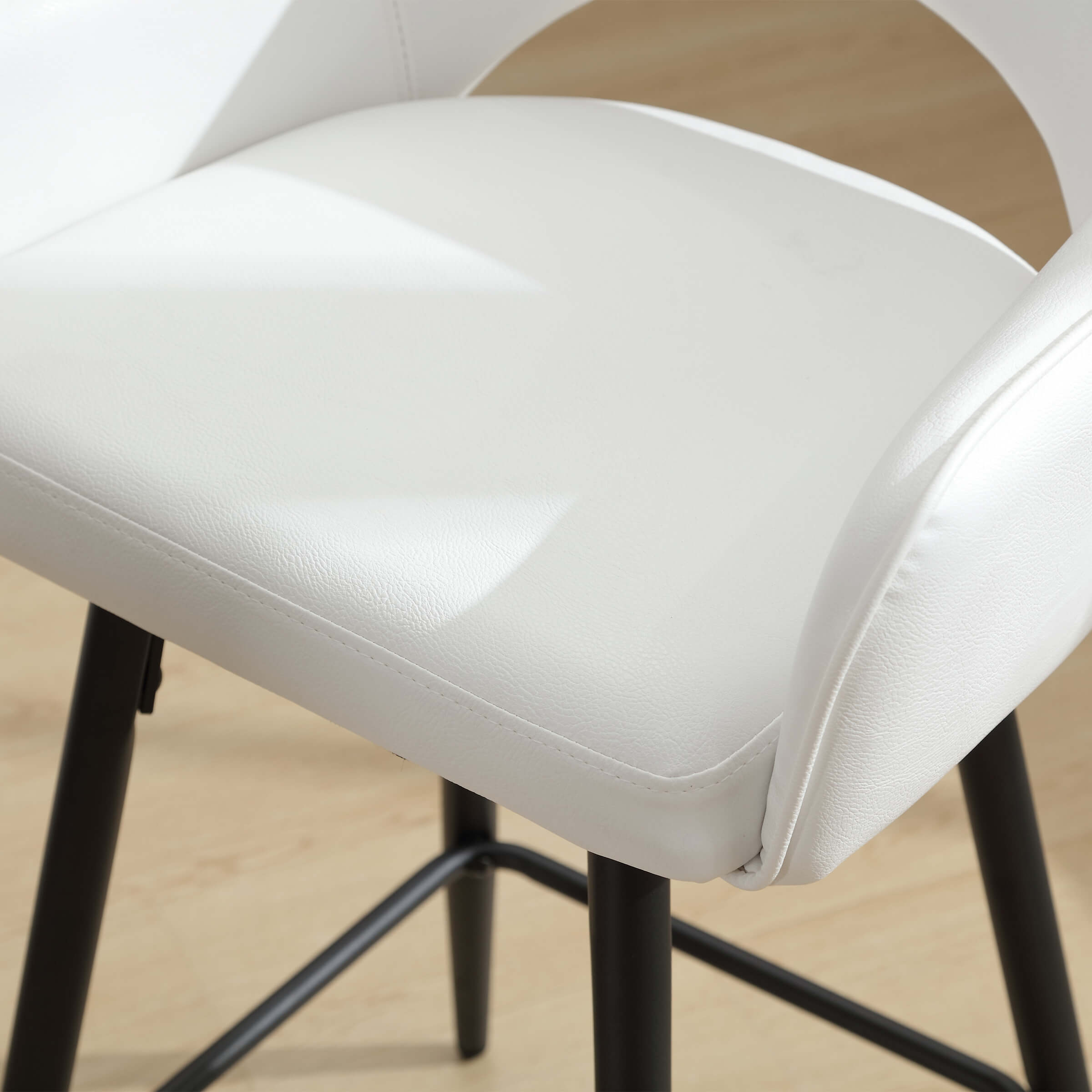 Close-up of seat edge on stool