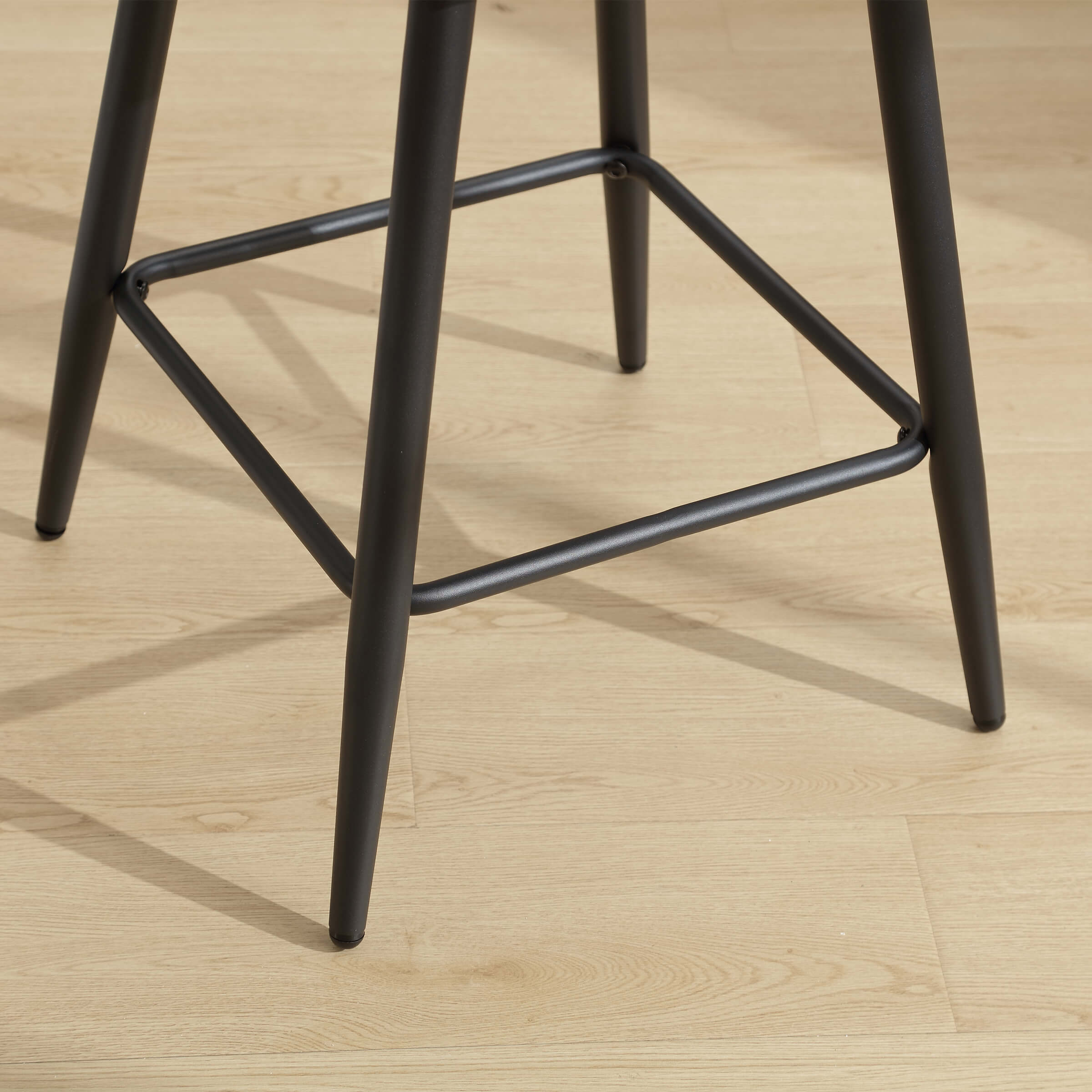 Base of stool showing frame and footrest