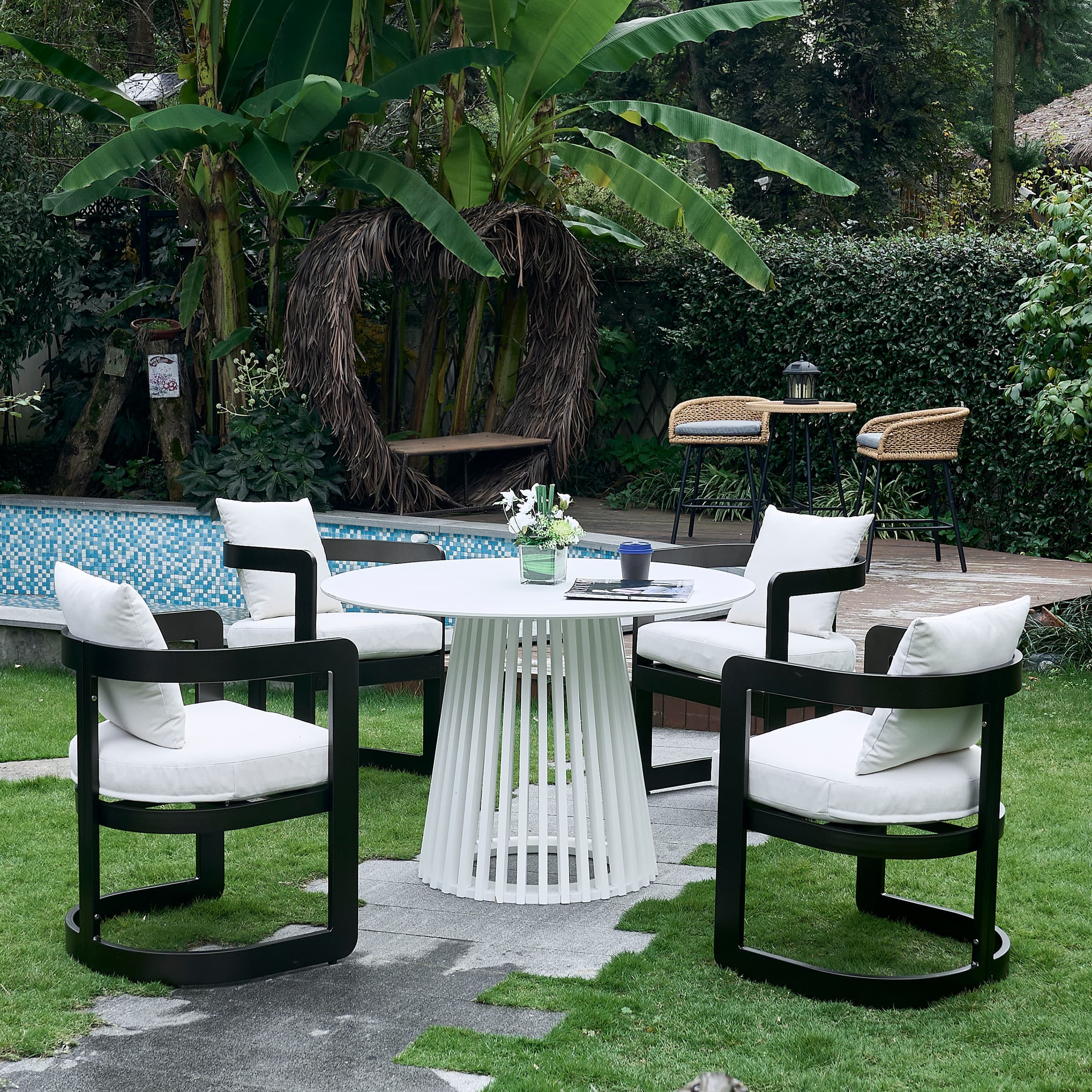 Group of outdoor chairs around round table in garden