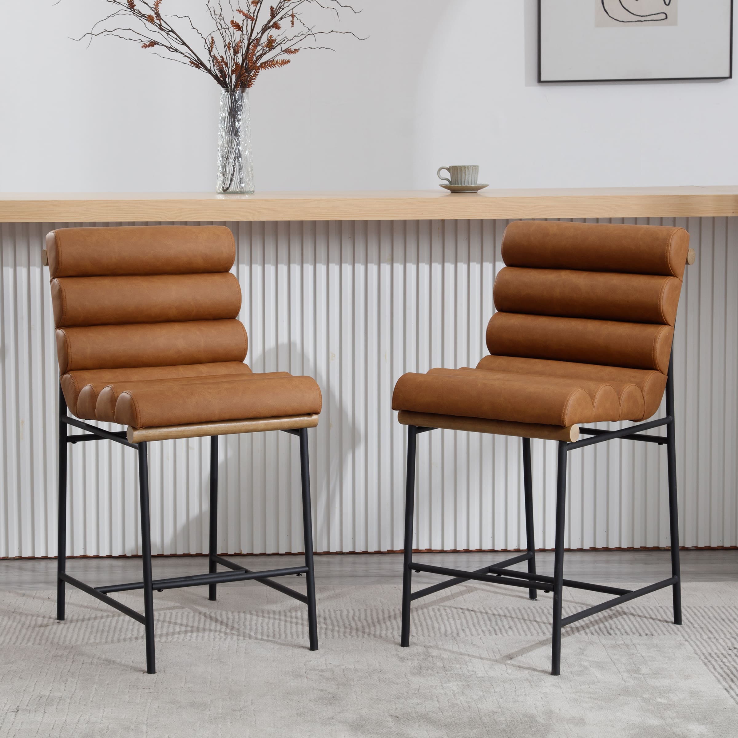 Two white upholstered stools at bar