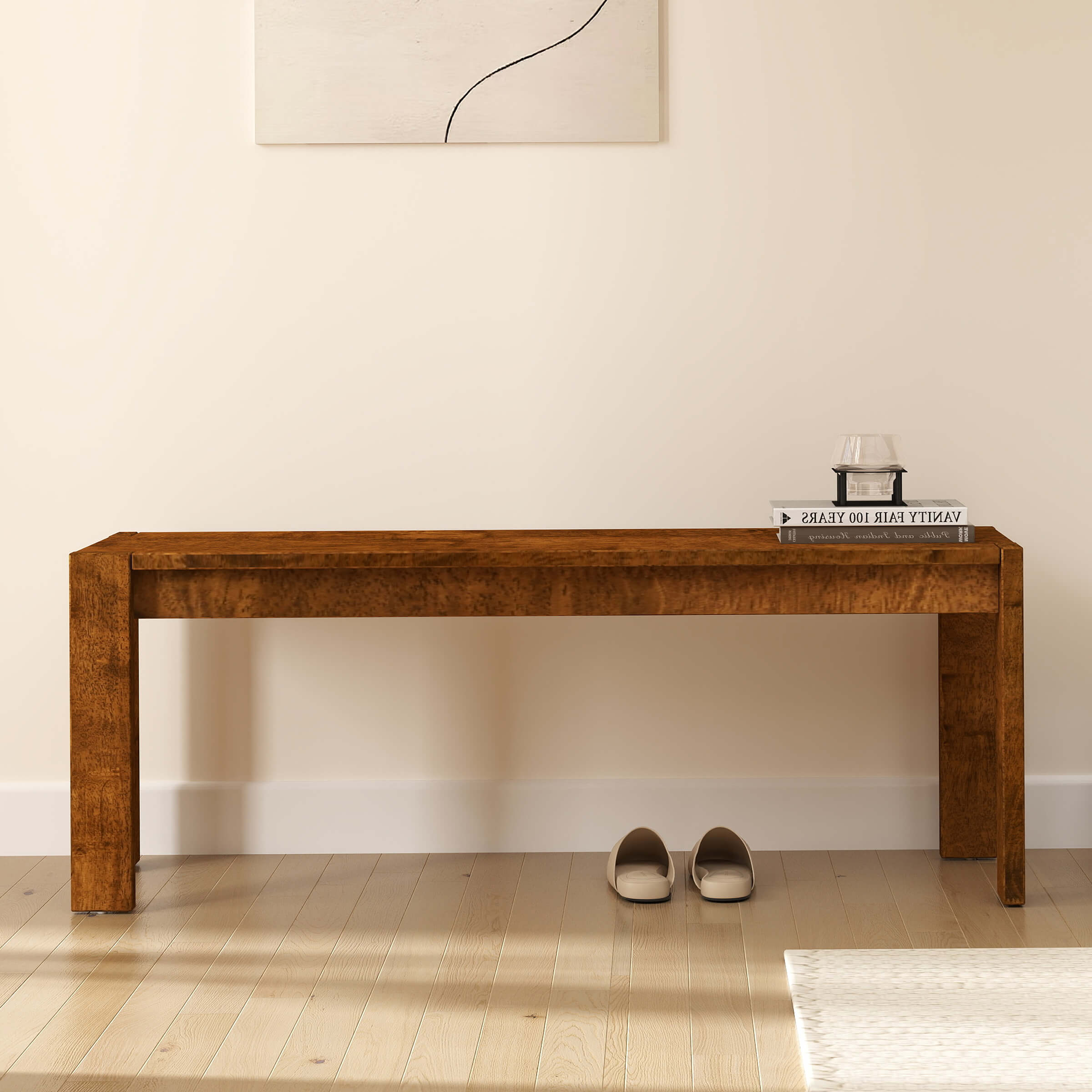 Bench in a room with wall art