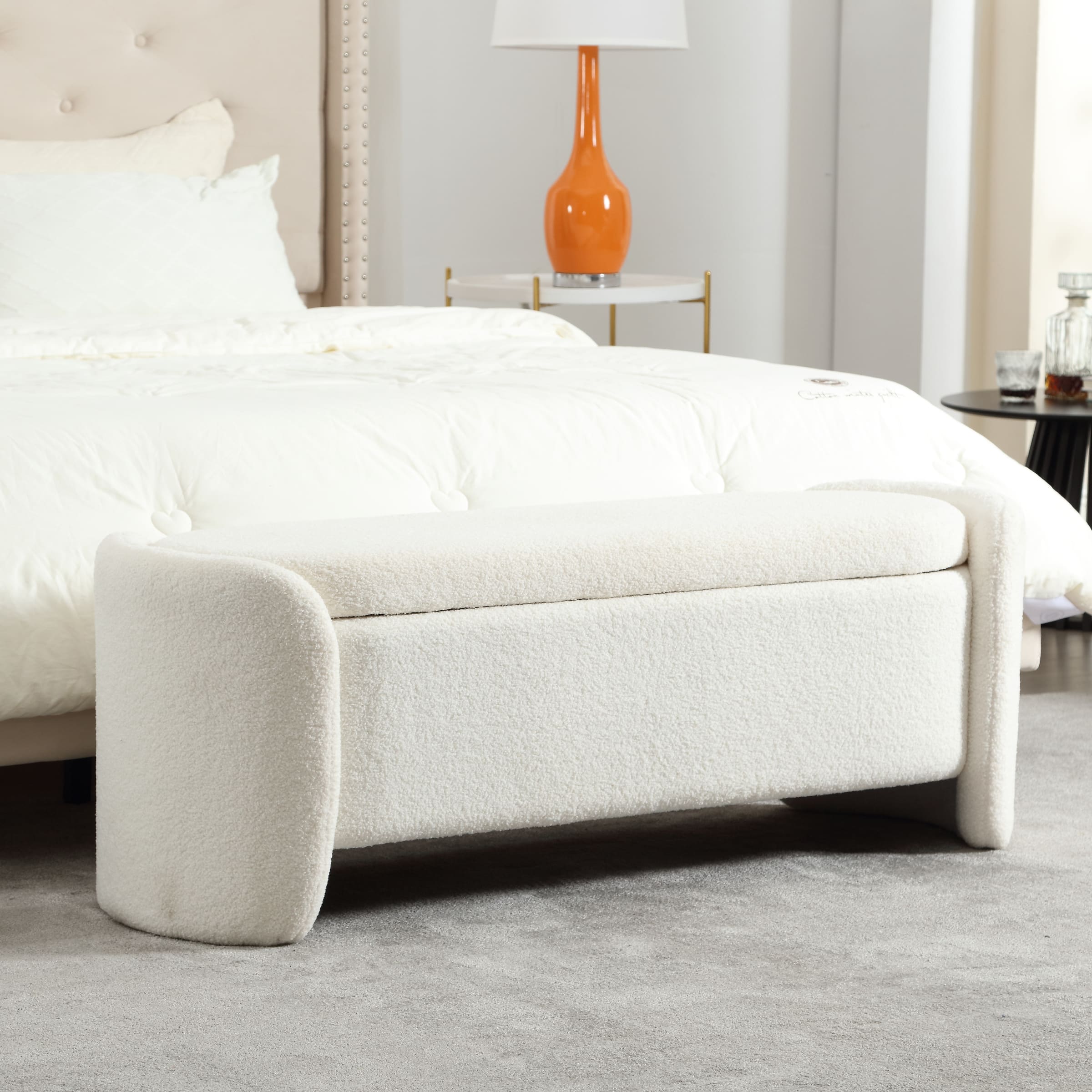White Sherpa storage bench at end of bed
