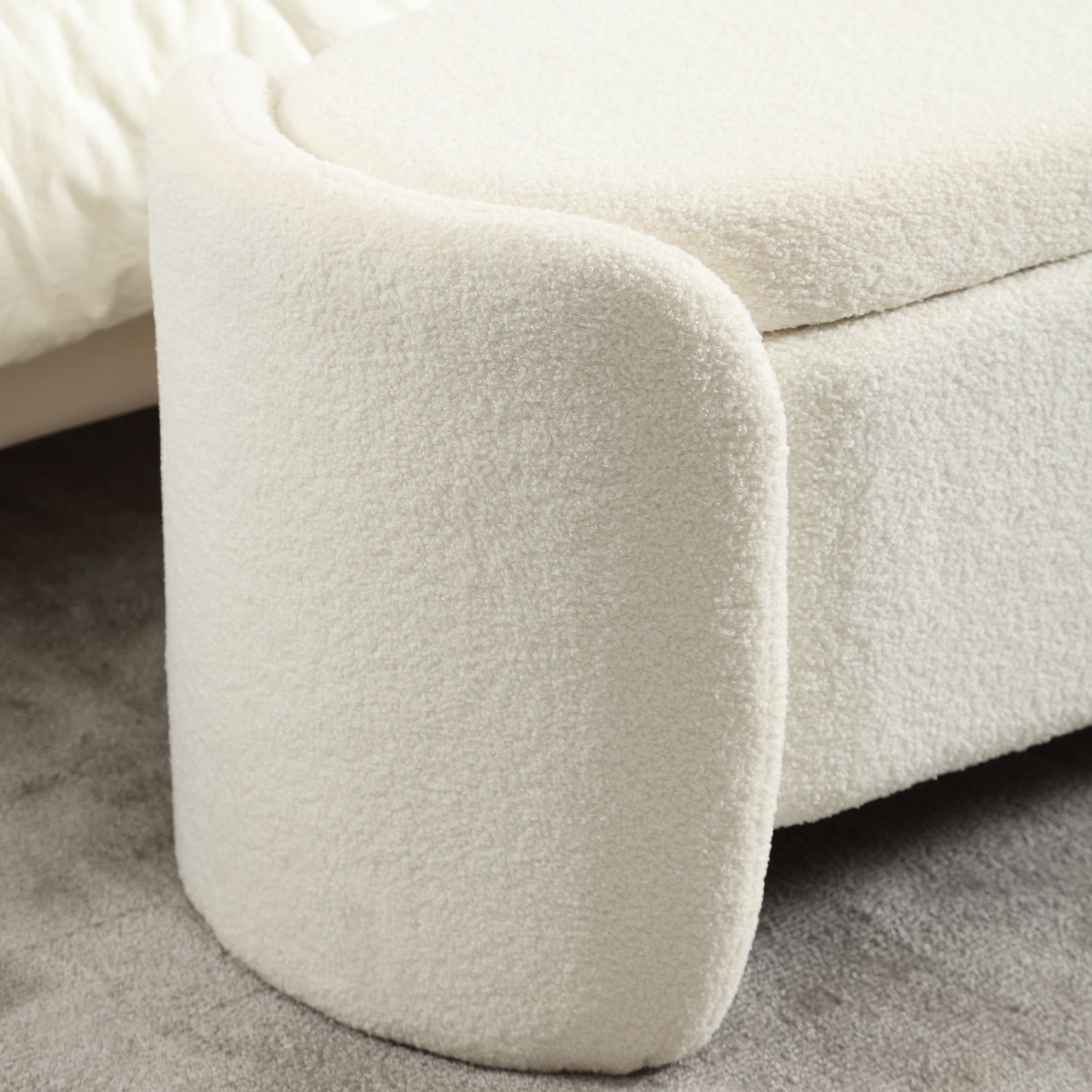 Corner of white sherpa bench with curved edge