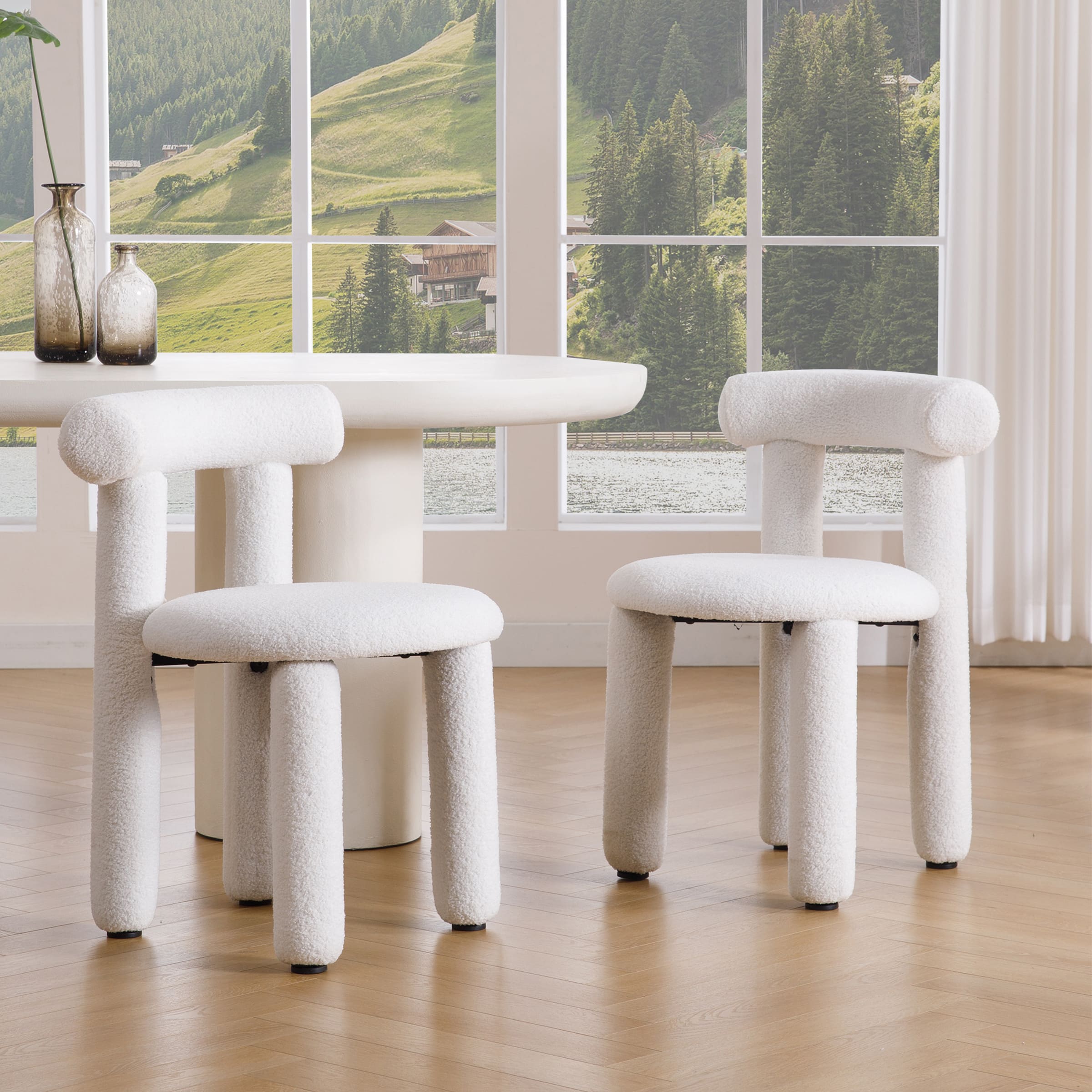 White sherpa dining chairs set of two with round table in bright room