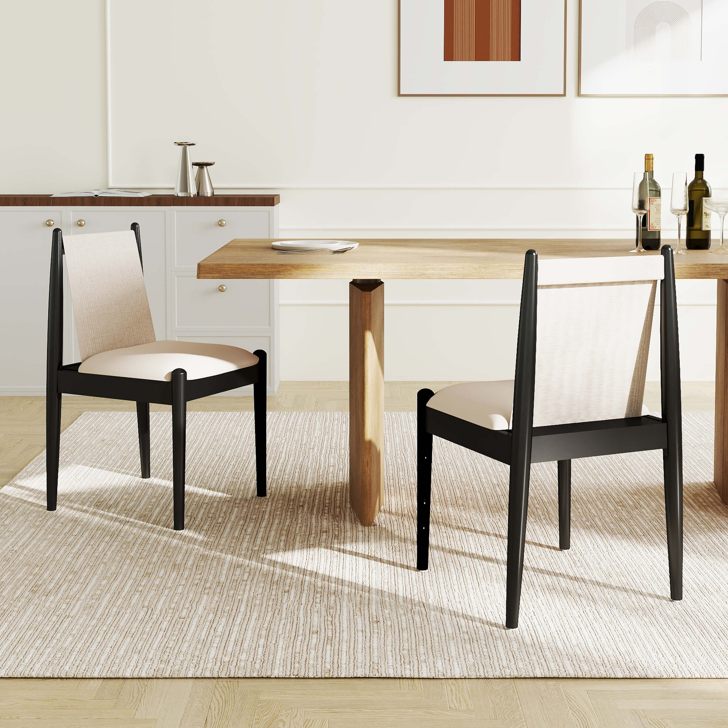 Two chairs around a wooden dining table in a bright room