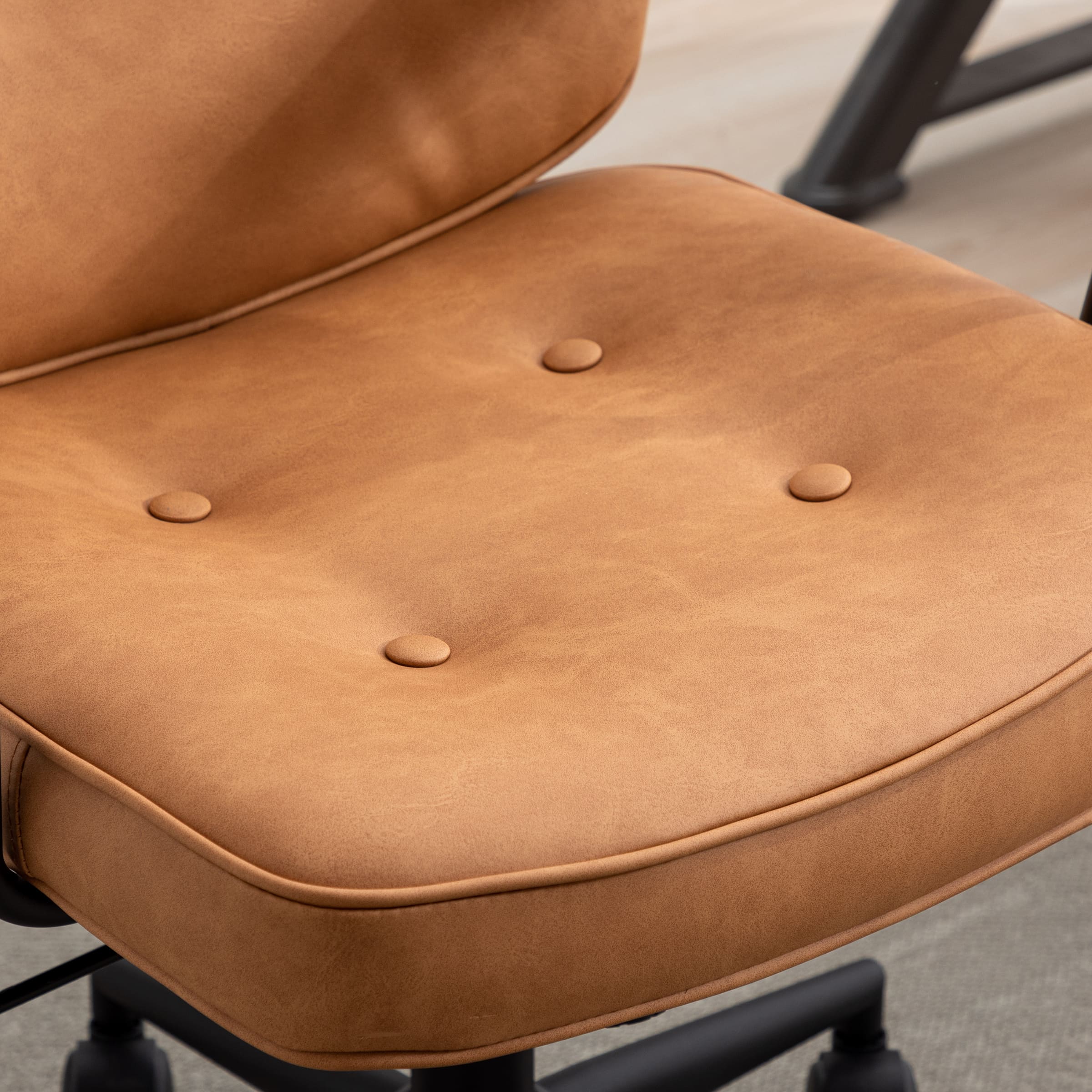 Close-up of brown leather tufted cushion