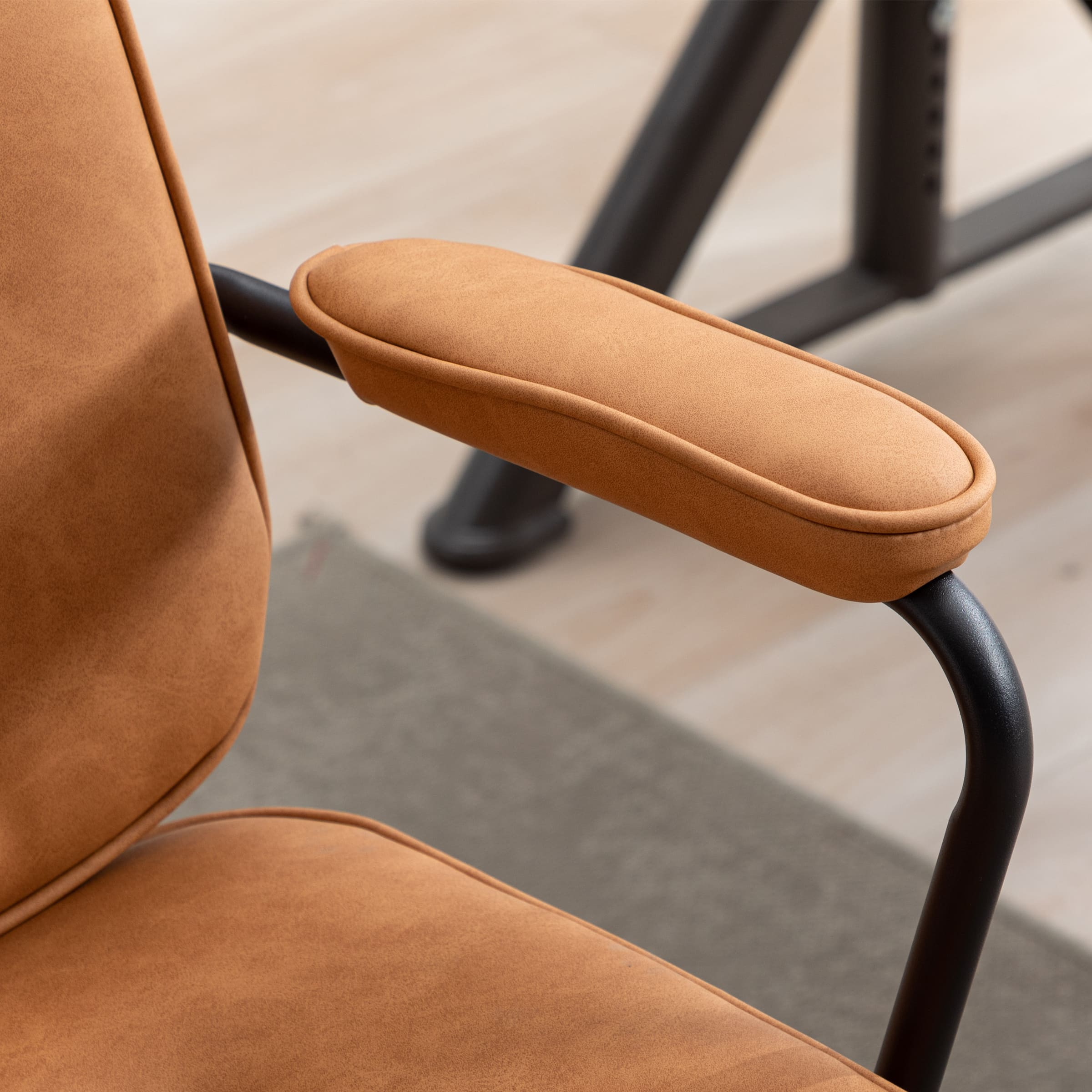 Armrest close-up on brown chair