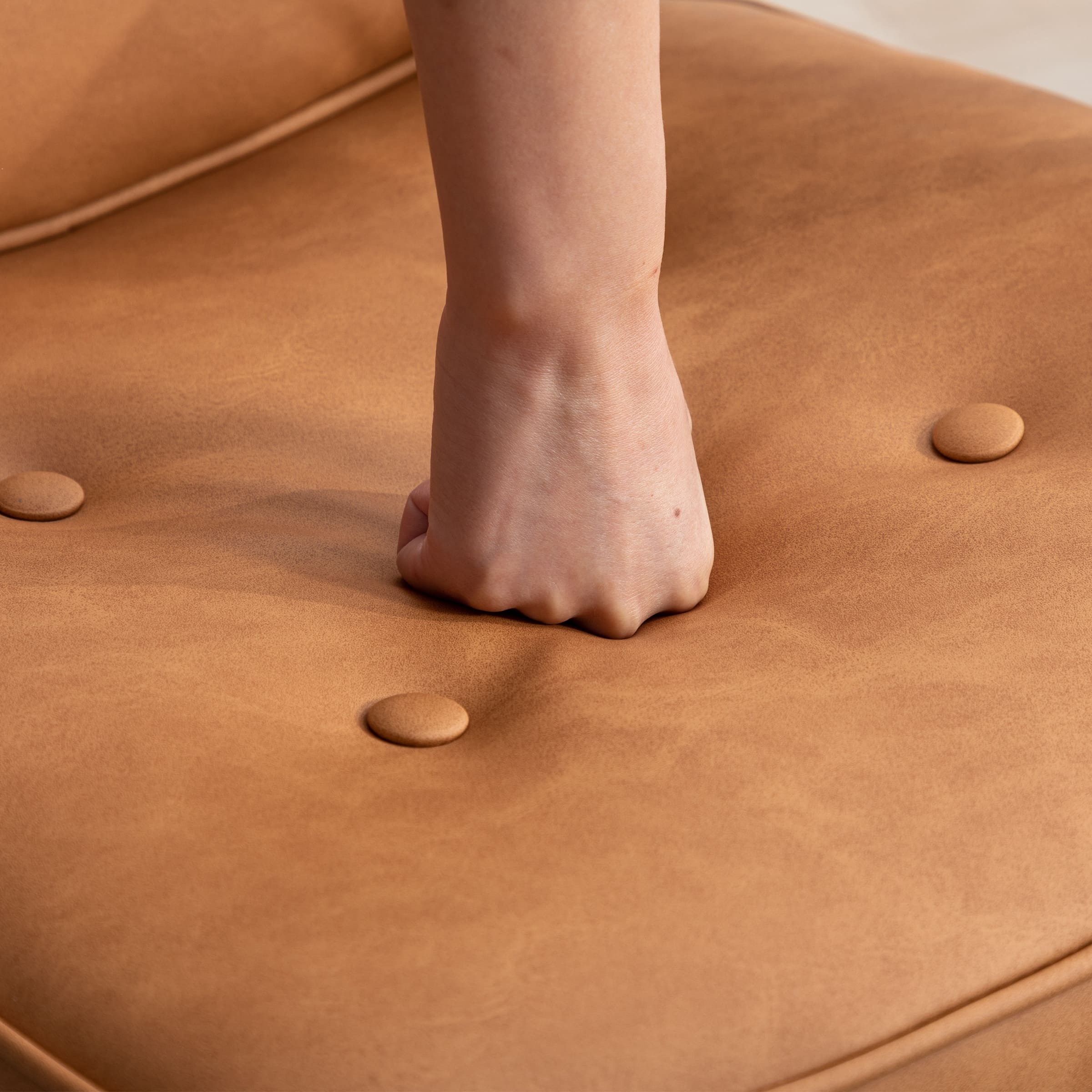 Close-up of top of tufted seat