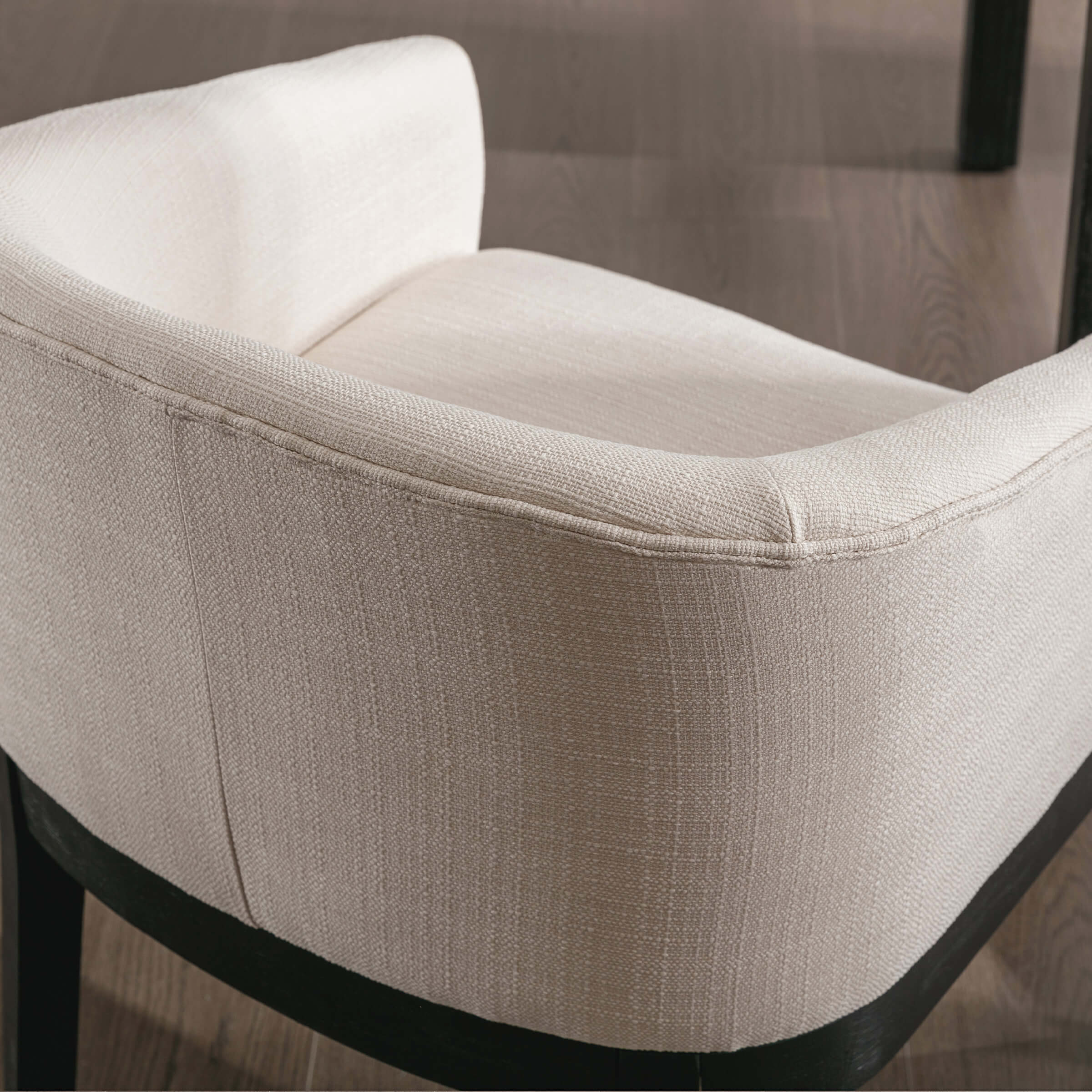 Armrest corner close-up on beige chair