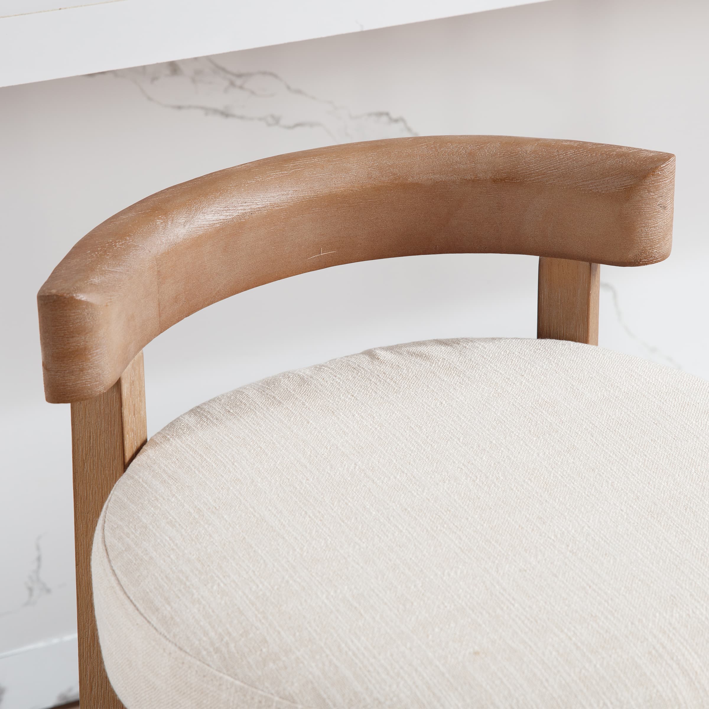 Close-up of wooden armrest on stool