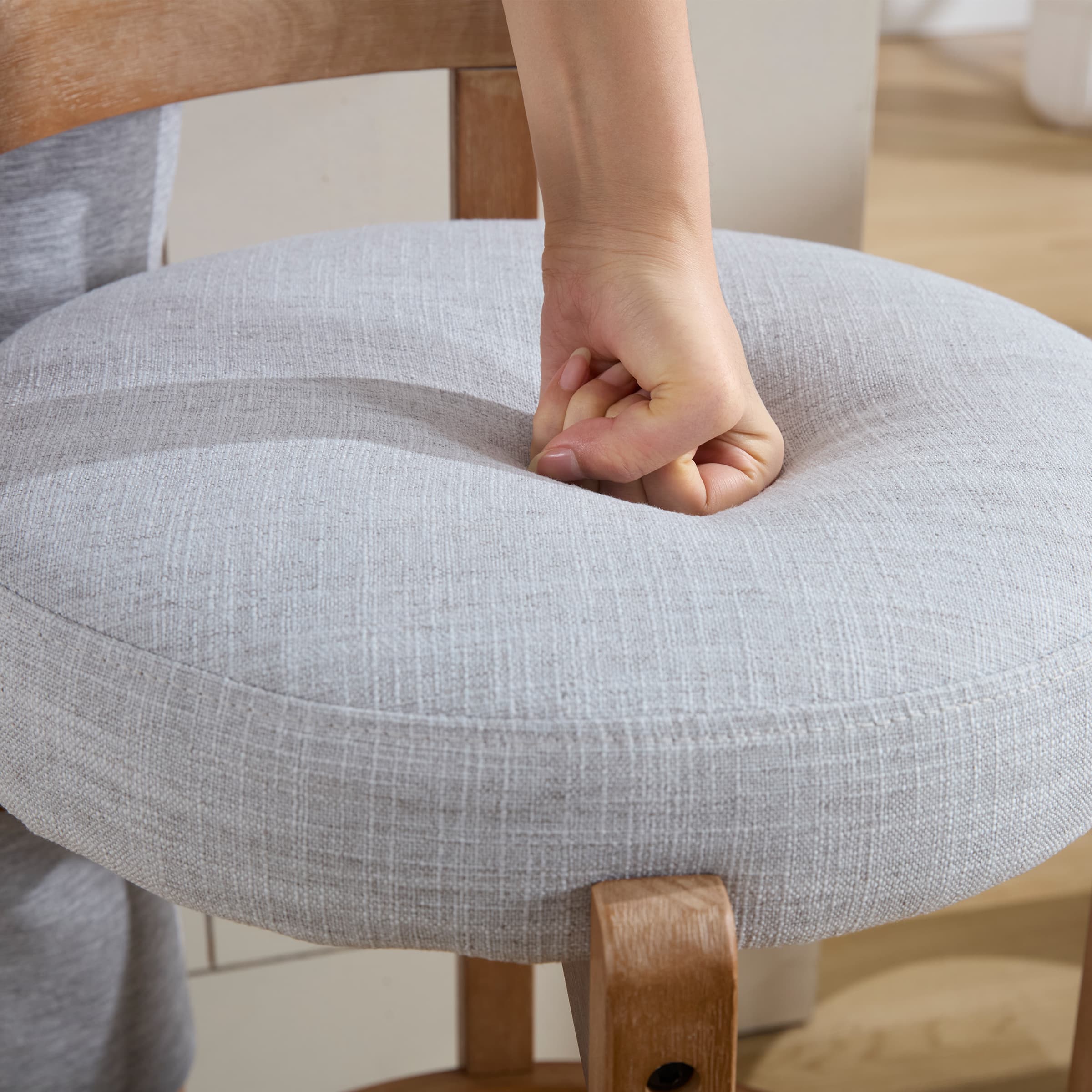 Finger presses into cushion