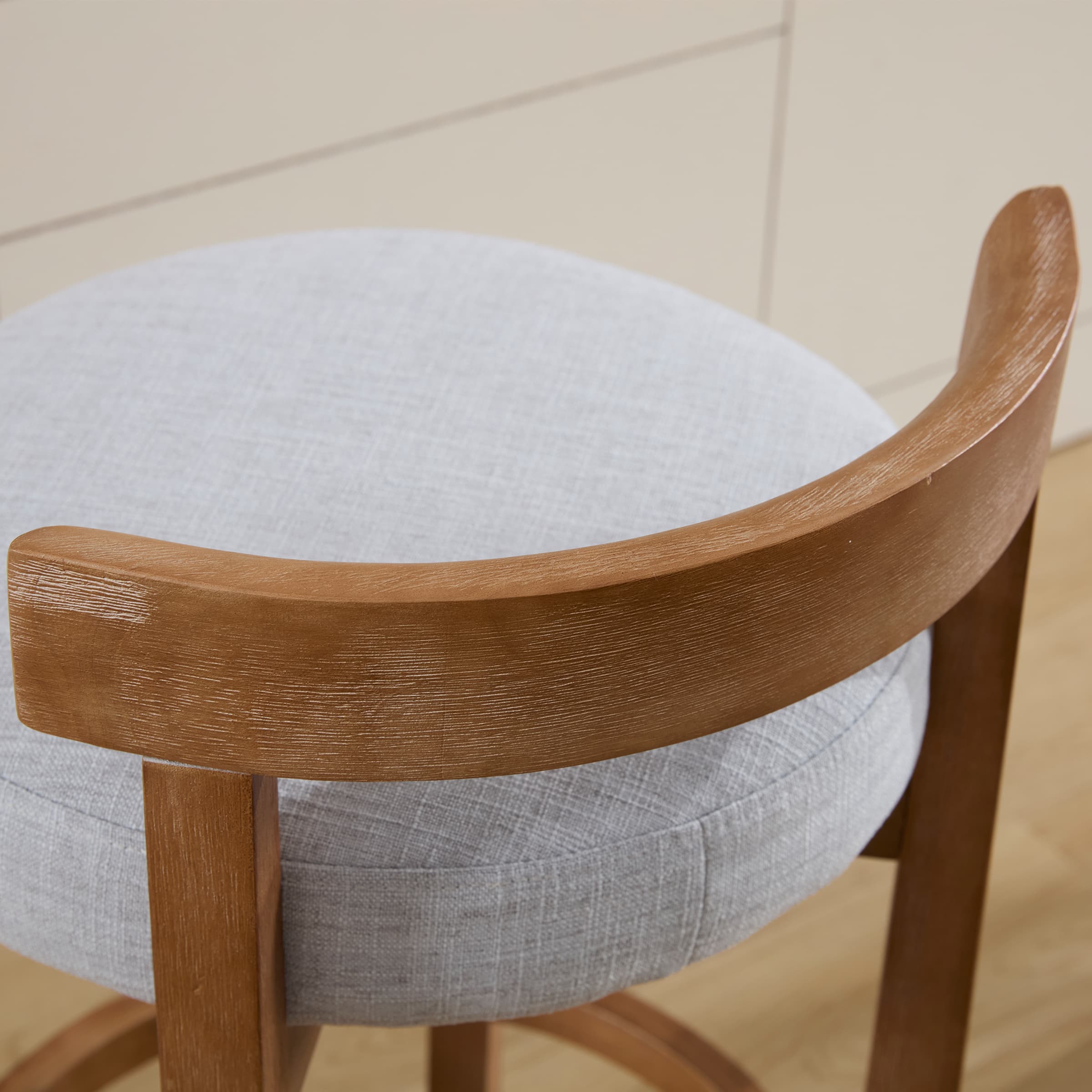 Curved wooden armrest close-up