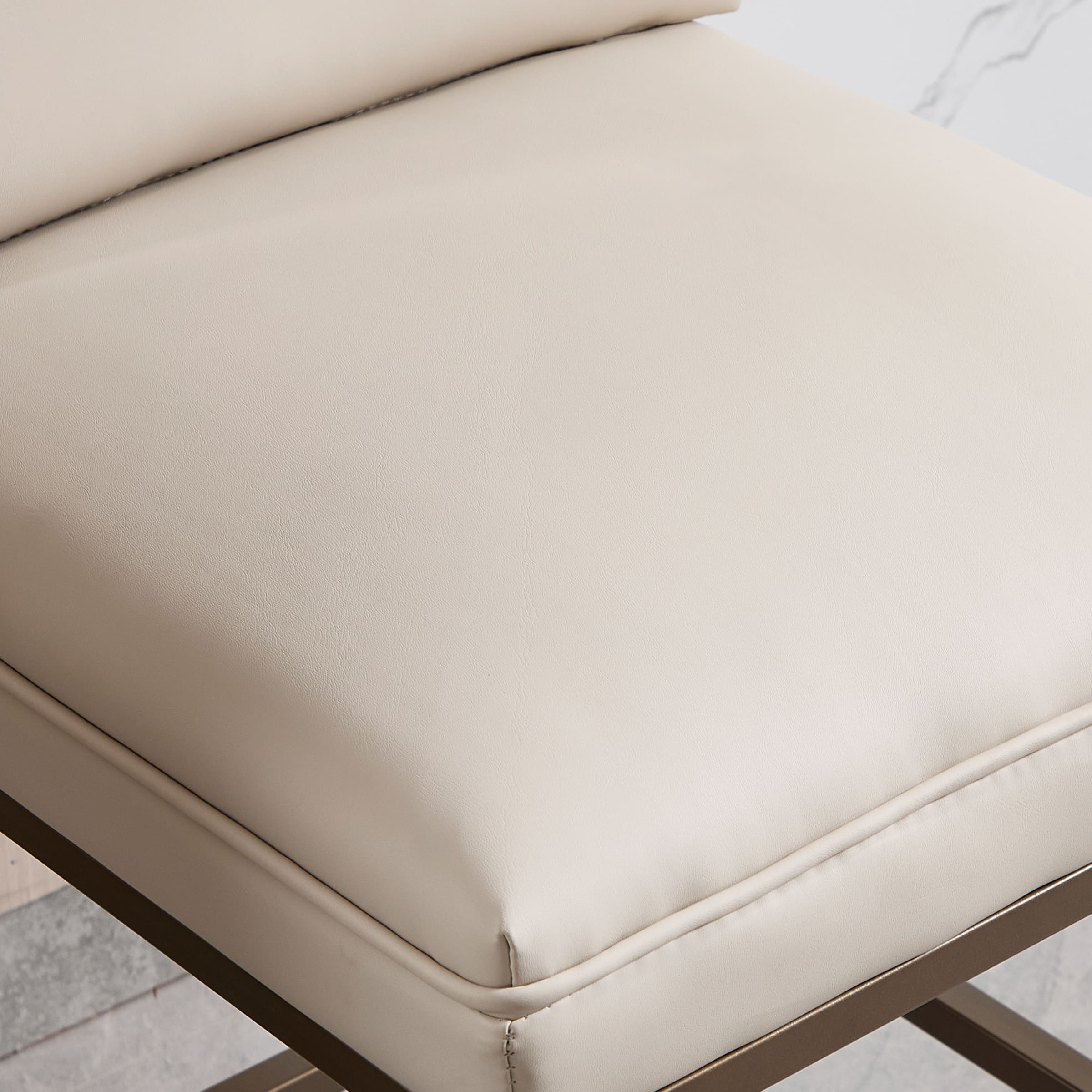 Close-up of cream leather cushion with stitch line