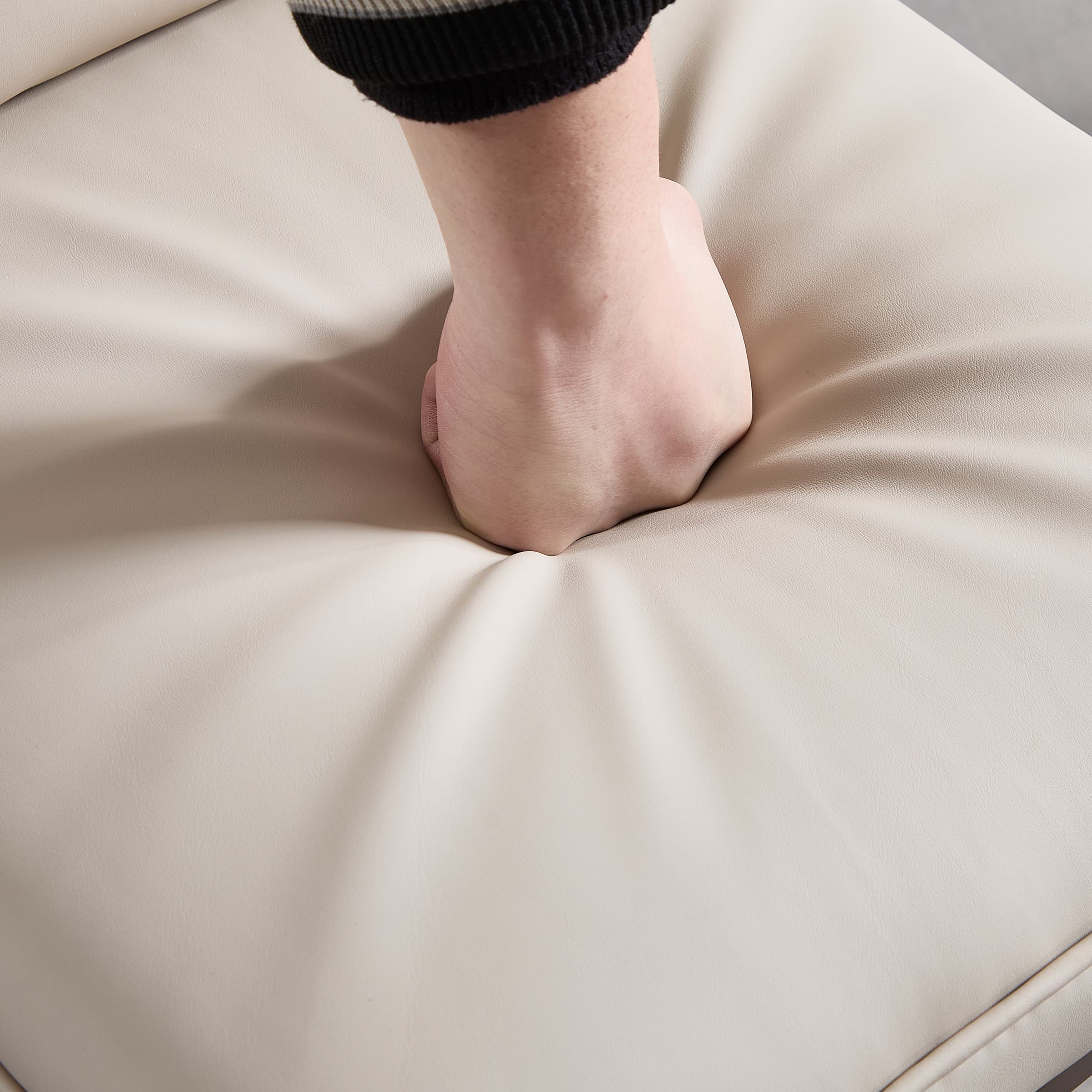 Hand pressing soft leather cushion