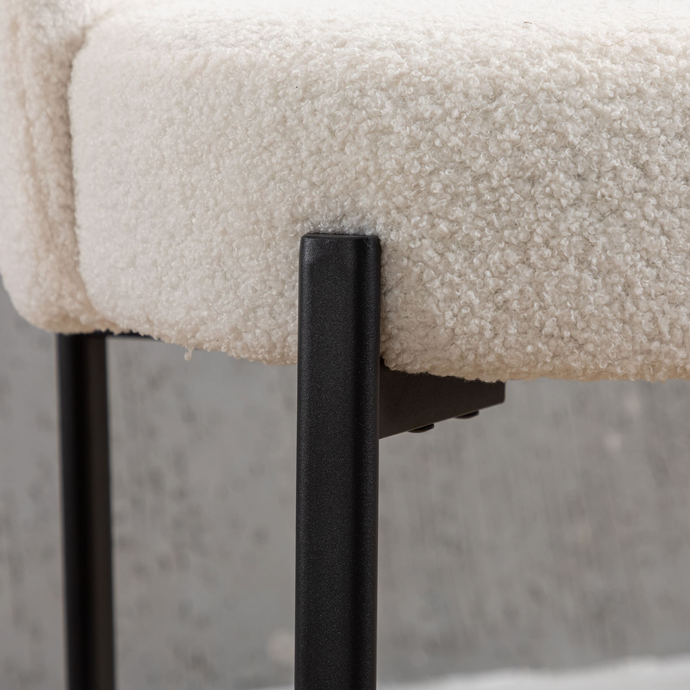 Close-up of black metal leg junction