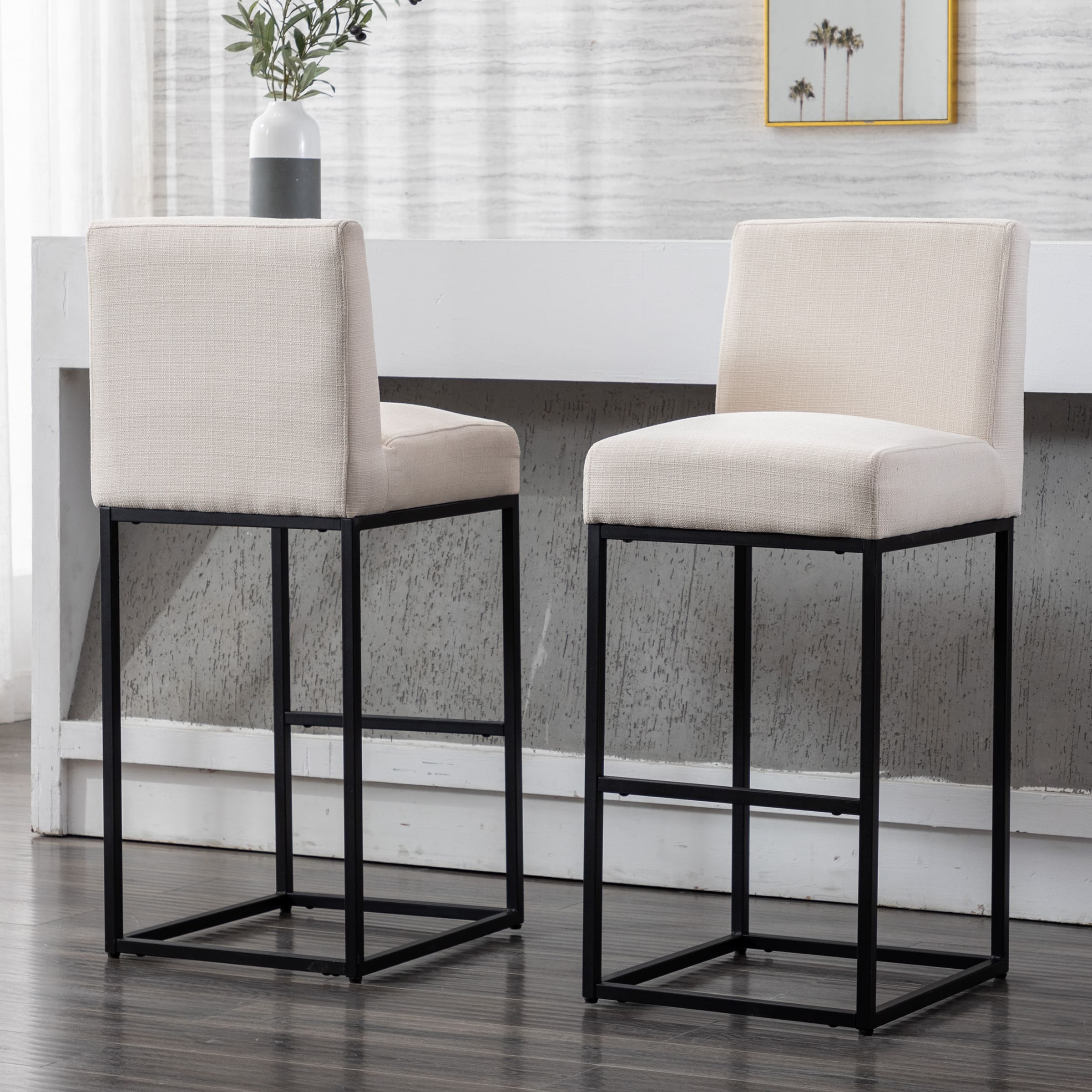 Two beige stools by a counter