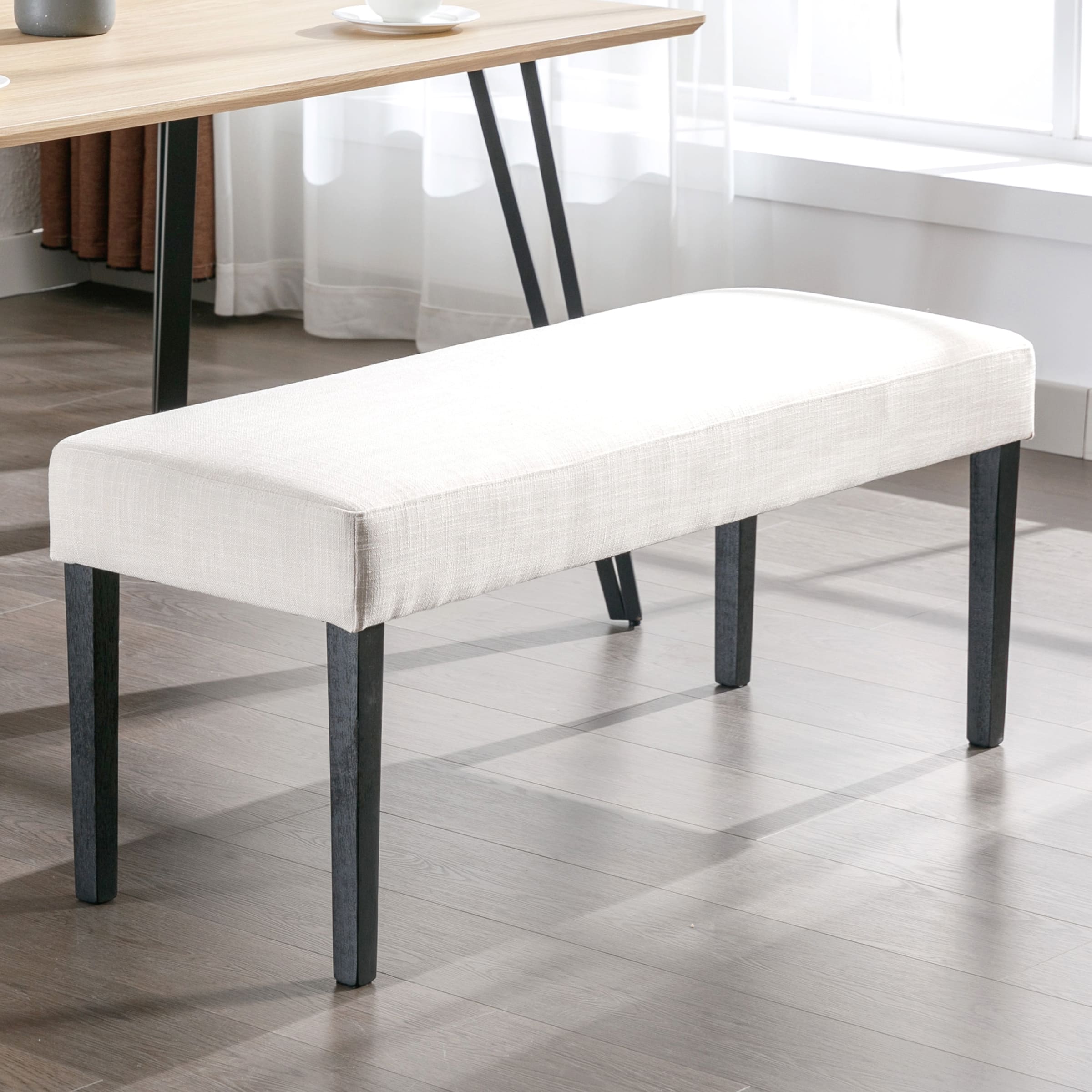 Dining bench under table with light streaming