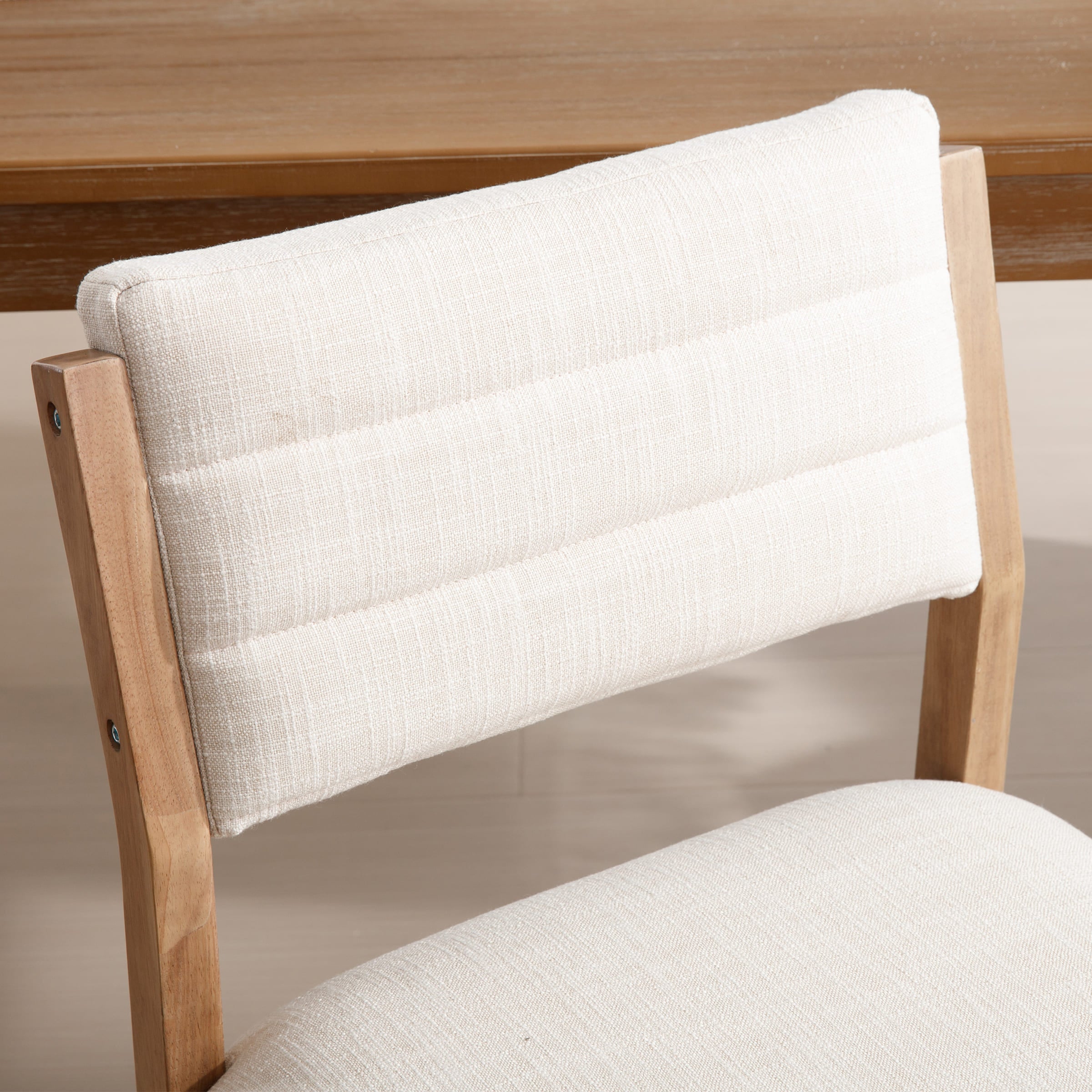 Close-up of white chair backrest stitching
