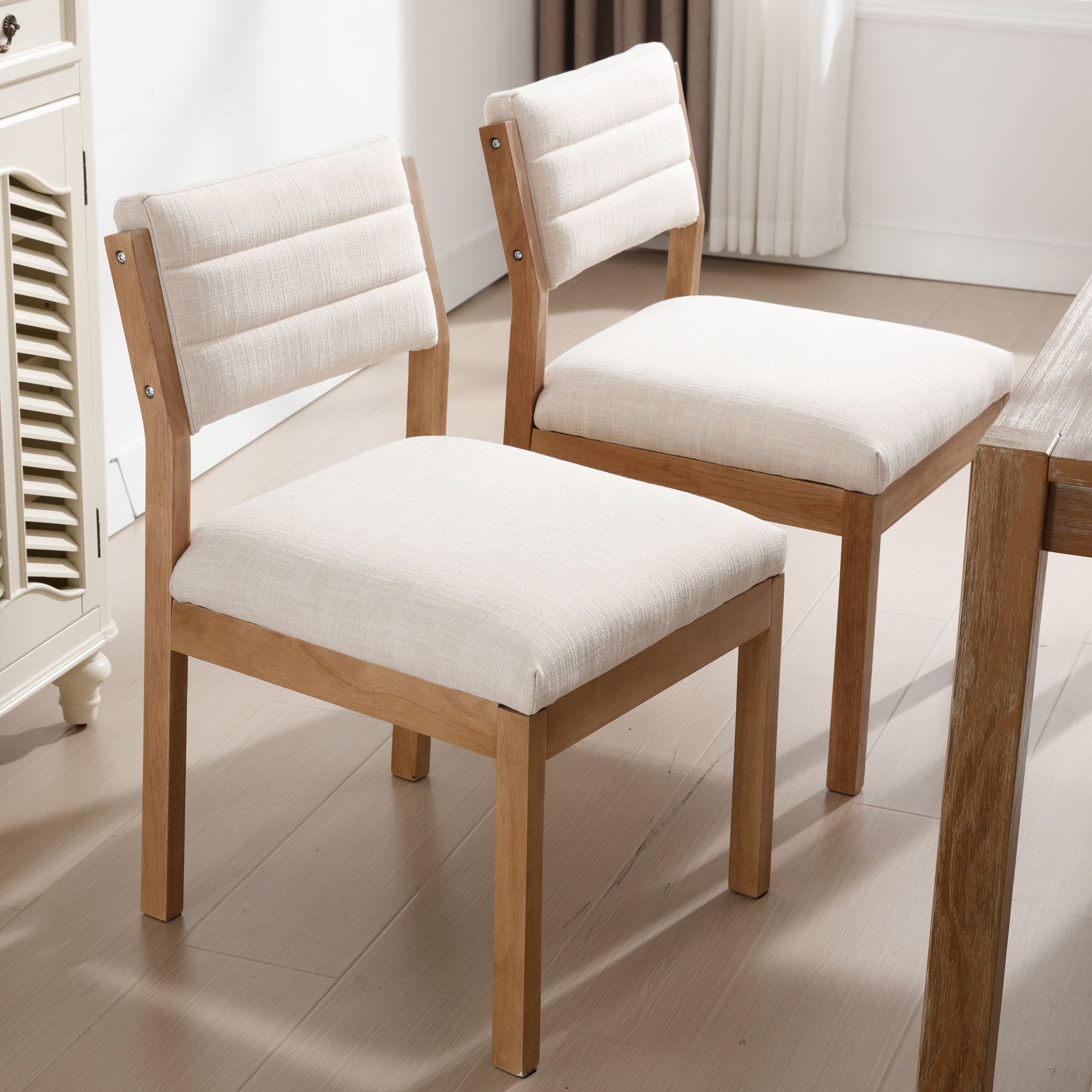 Two white chairs around table