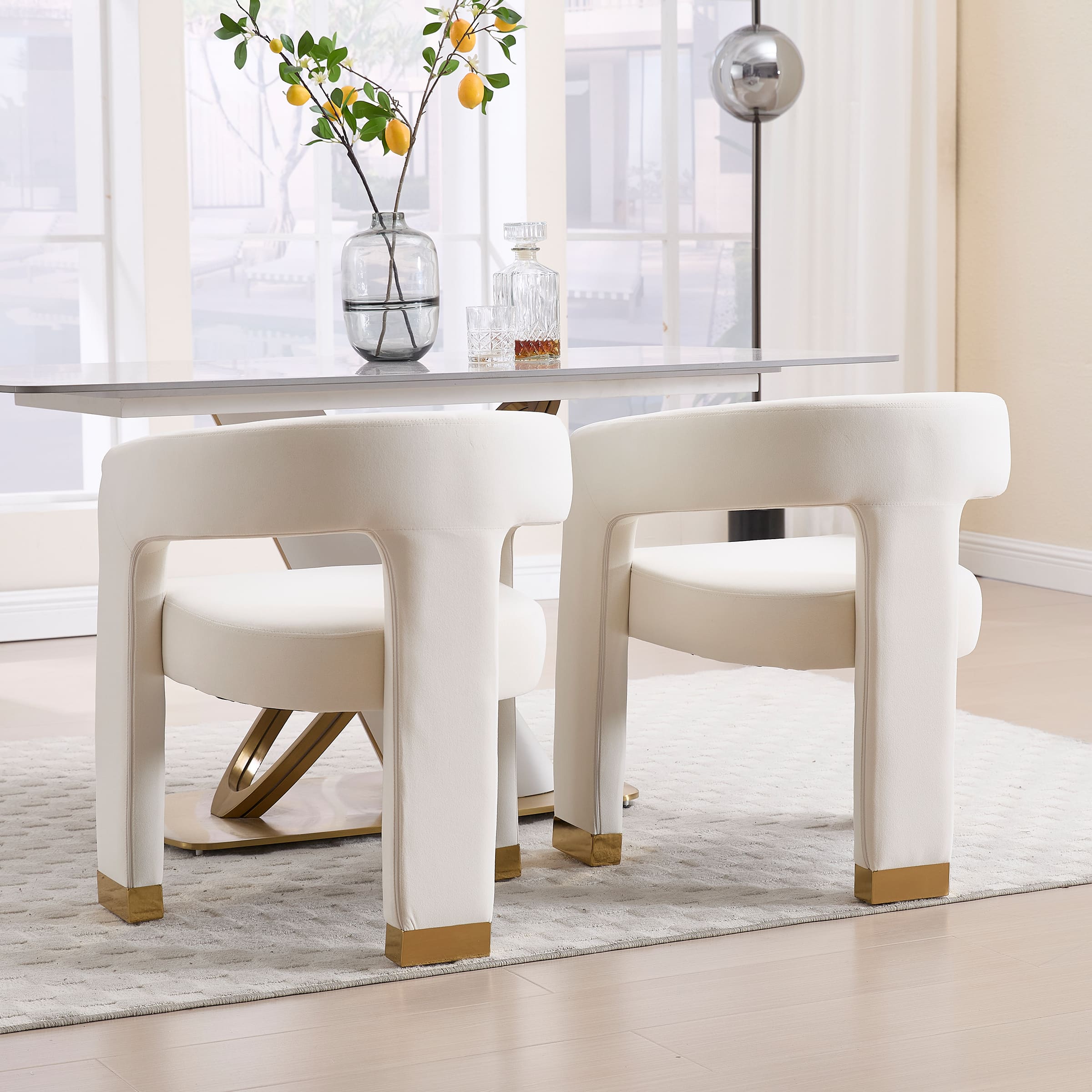 Open-back velvet dining chairs around a dining table