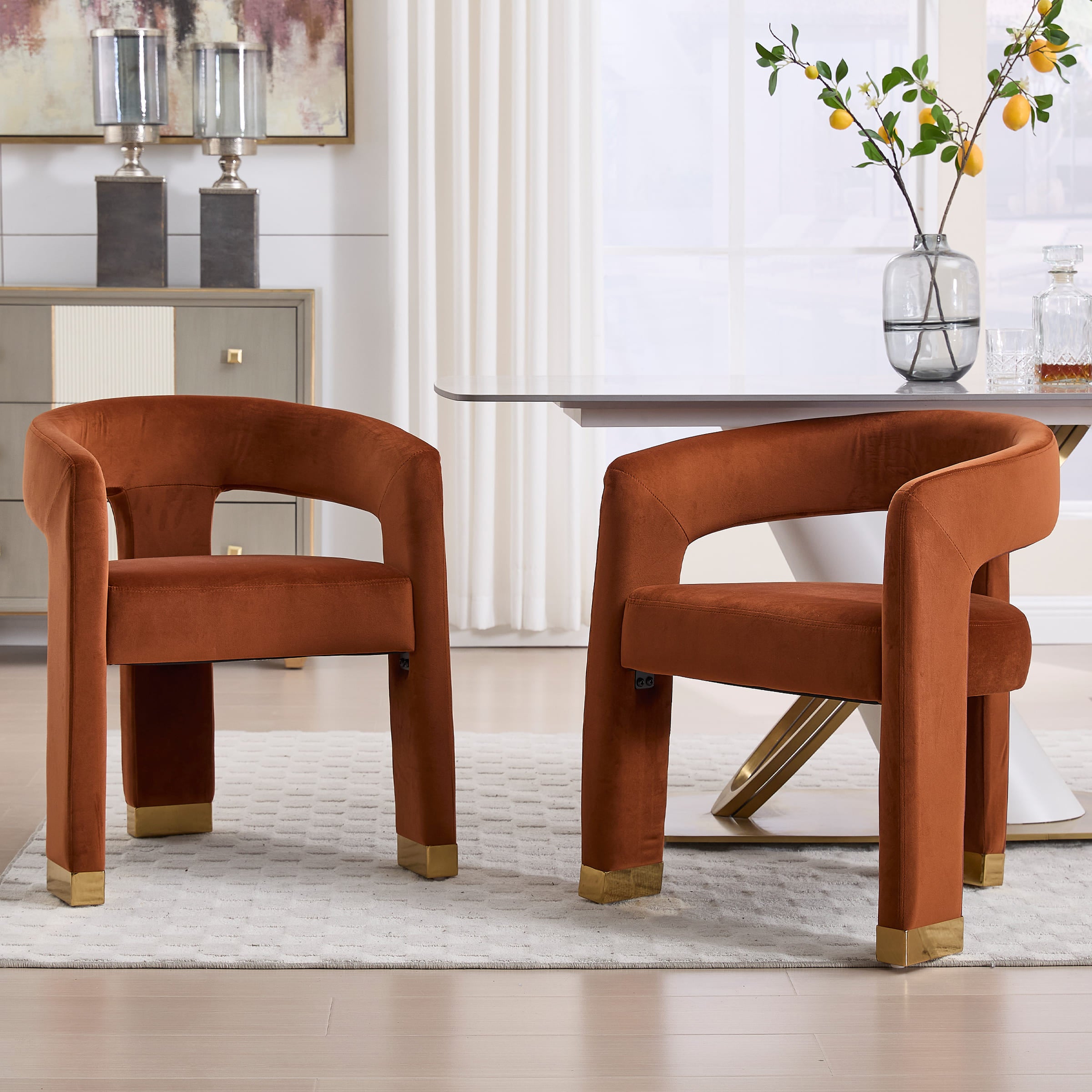 Two orange-brown chairs with table