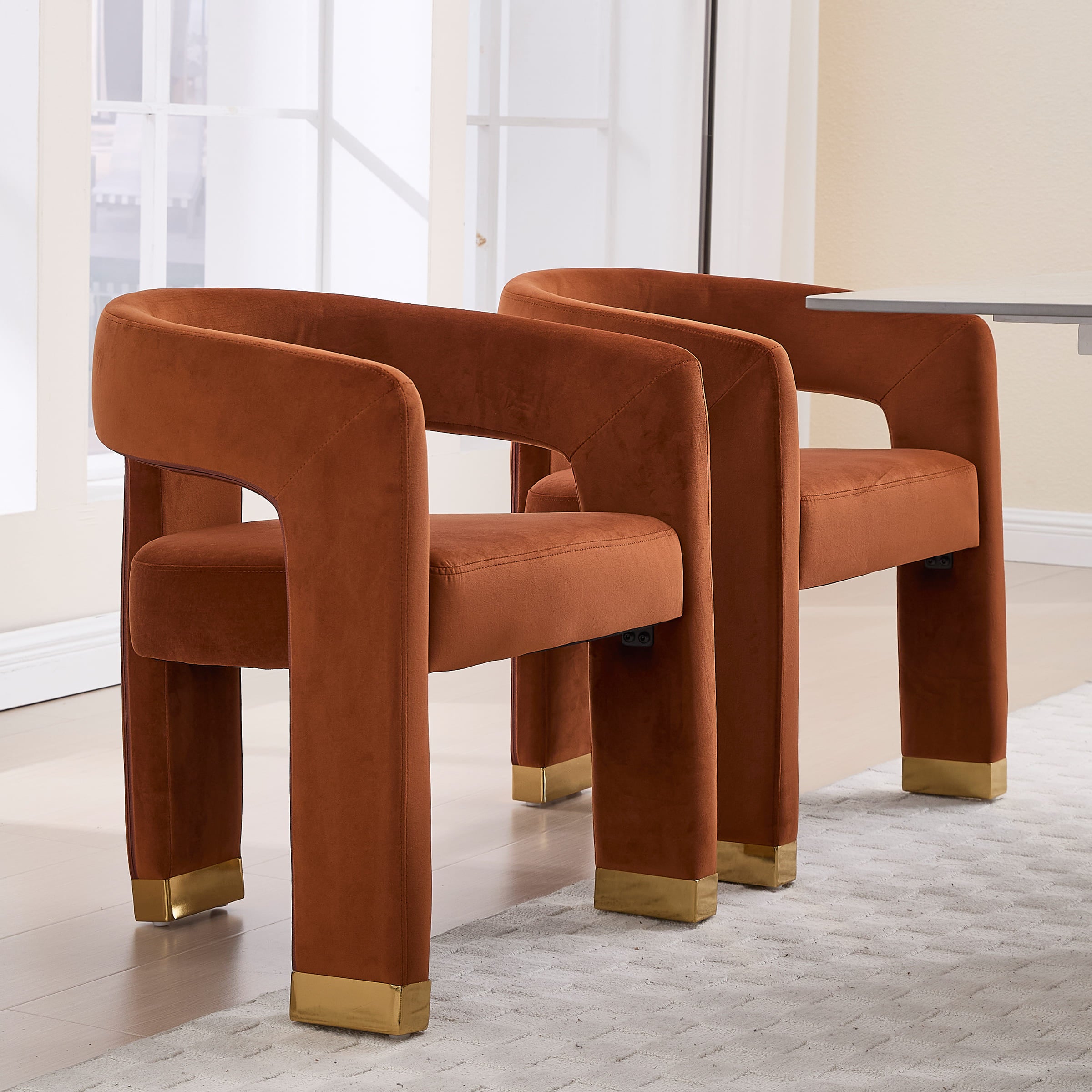 Three orange-brown chairs