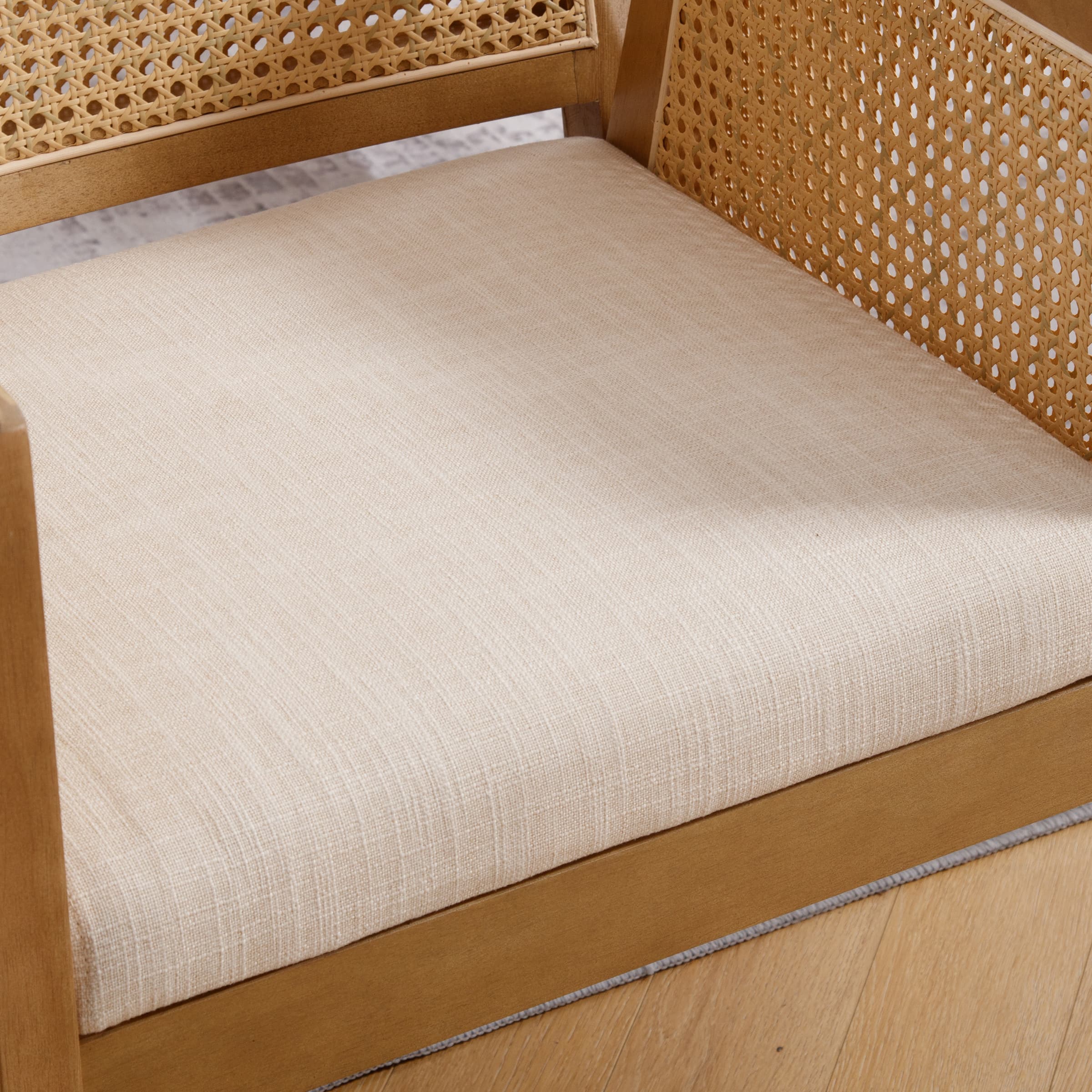 Close-up of chair arm and caned panel