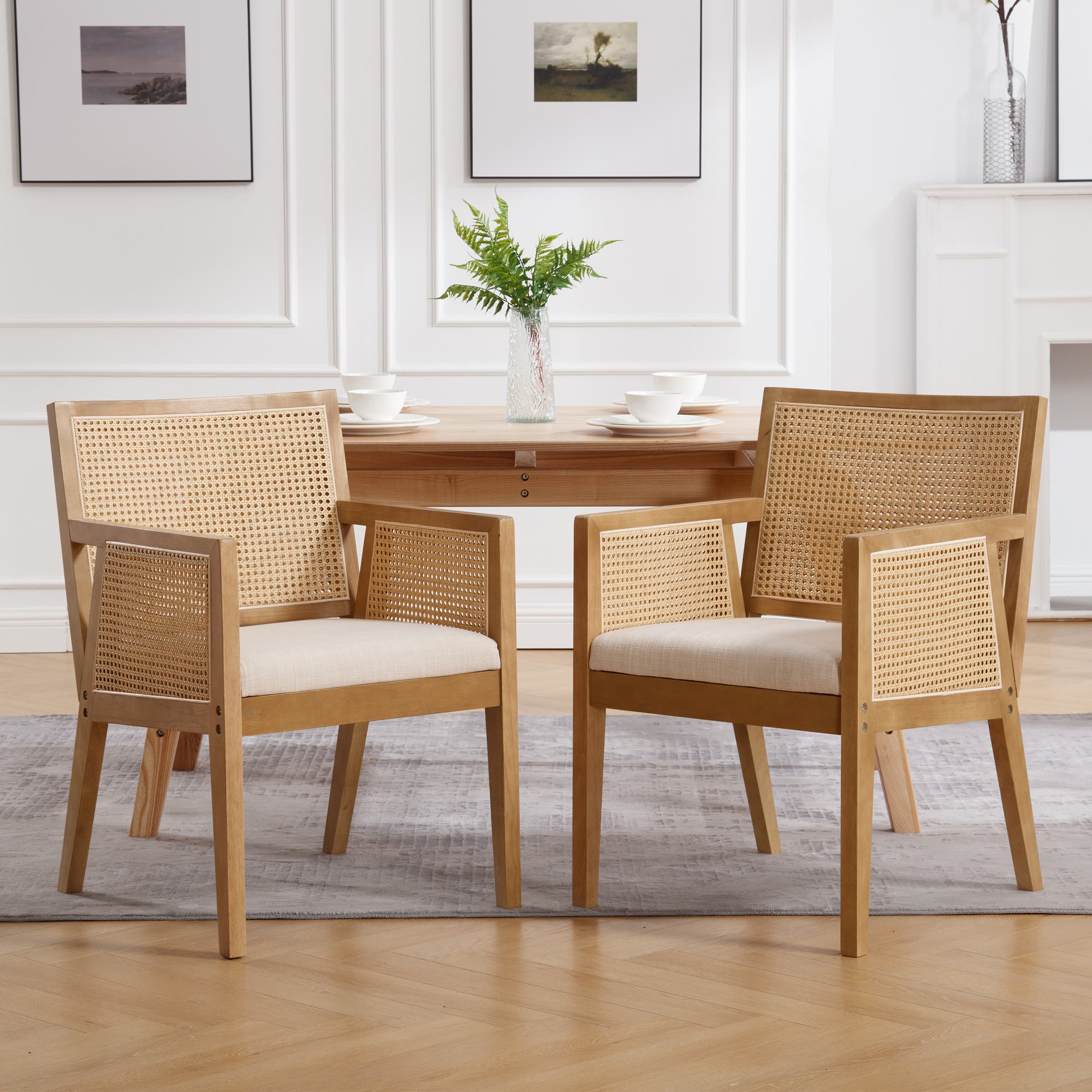 Chairs around a table in a white room with centerpiece