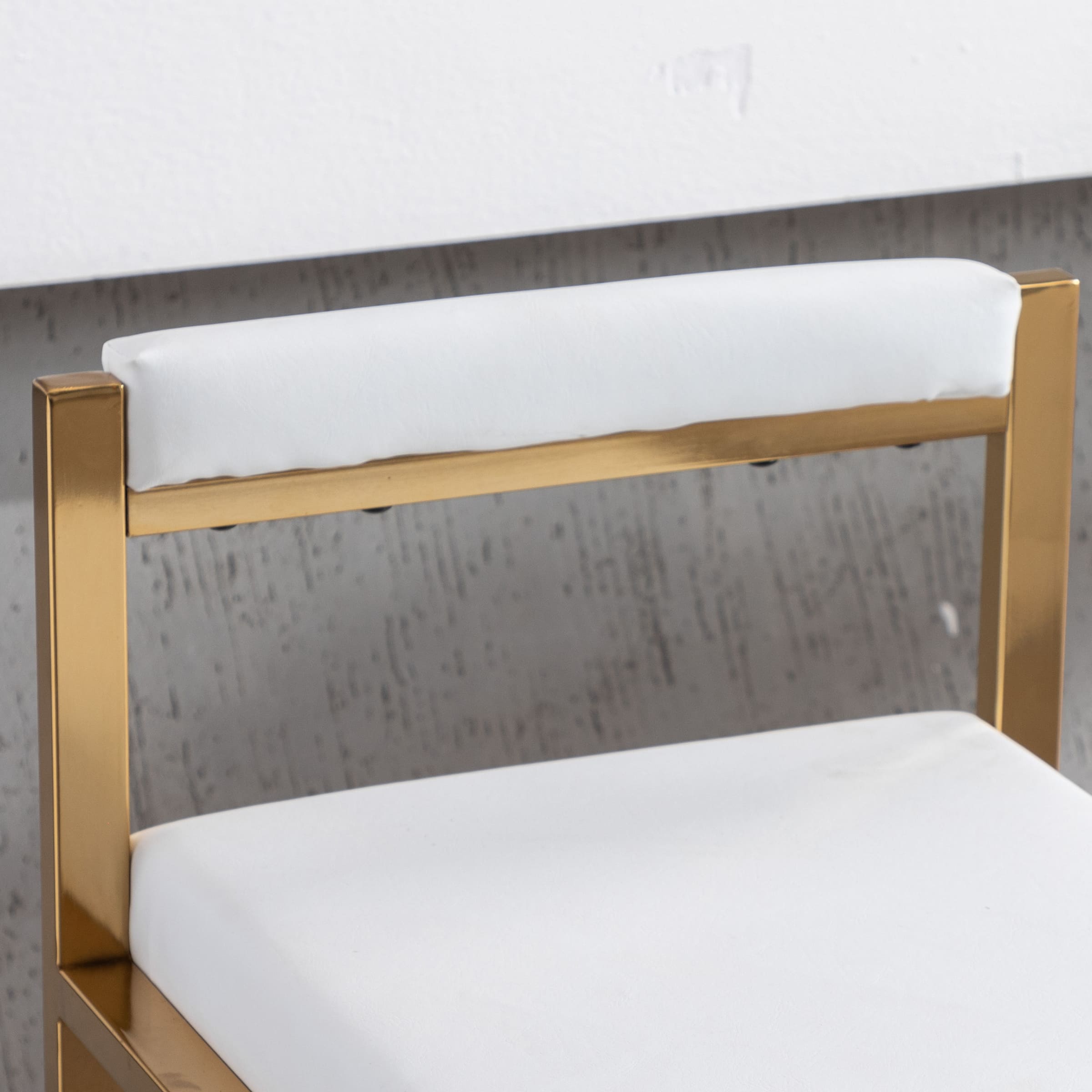 Close-up of leather-like white cushion edge