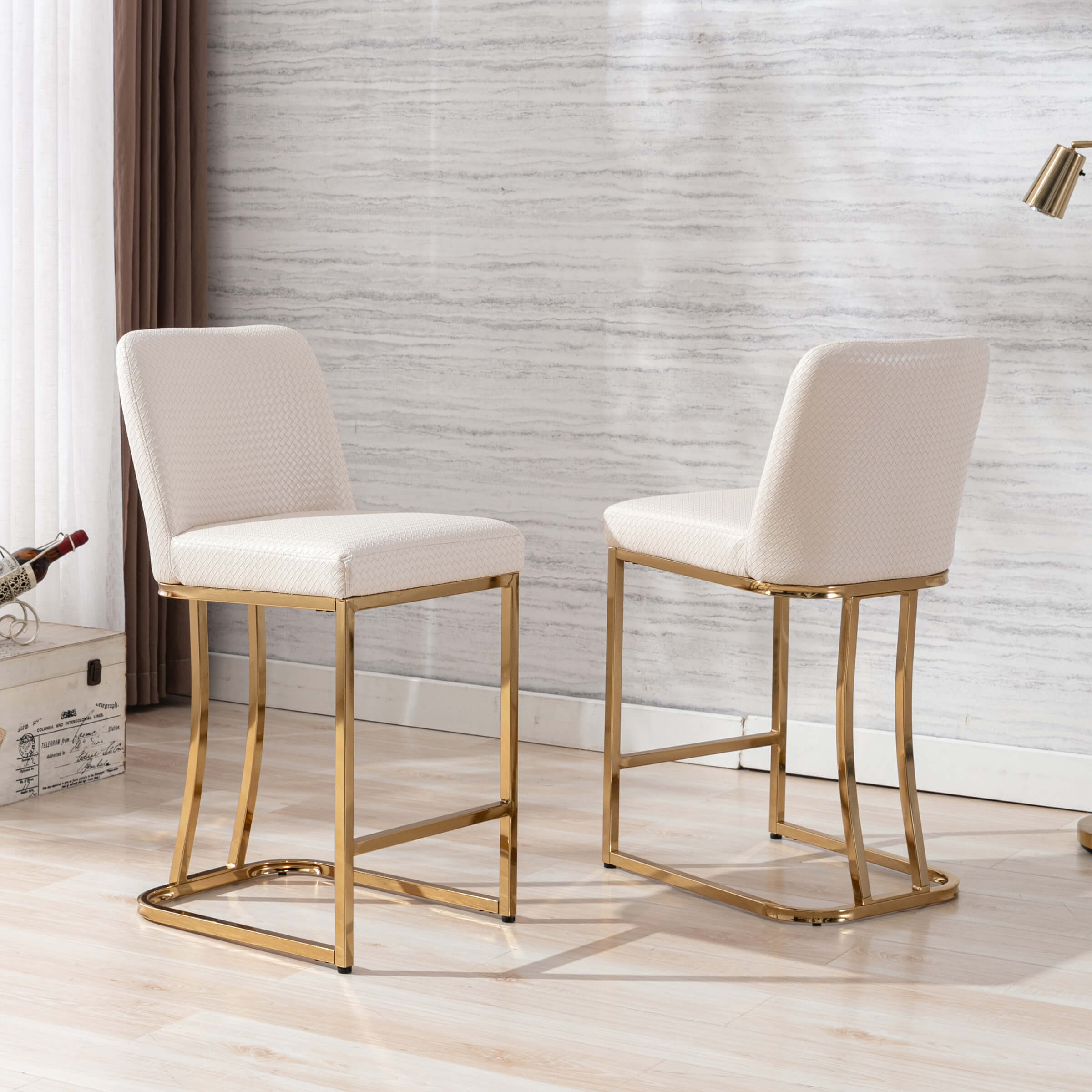 Two cream bar stools in room