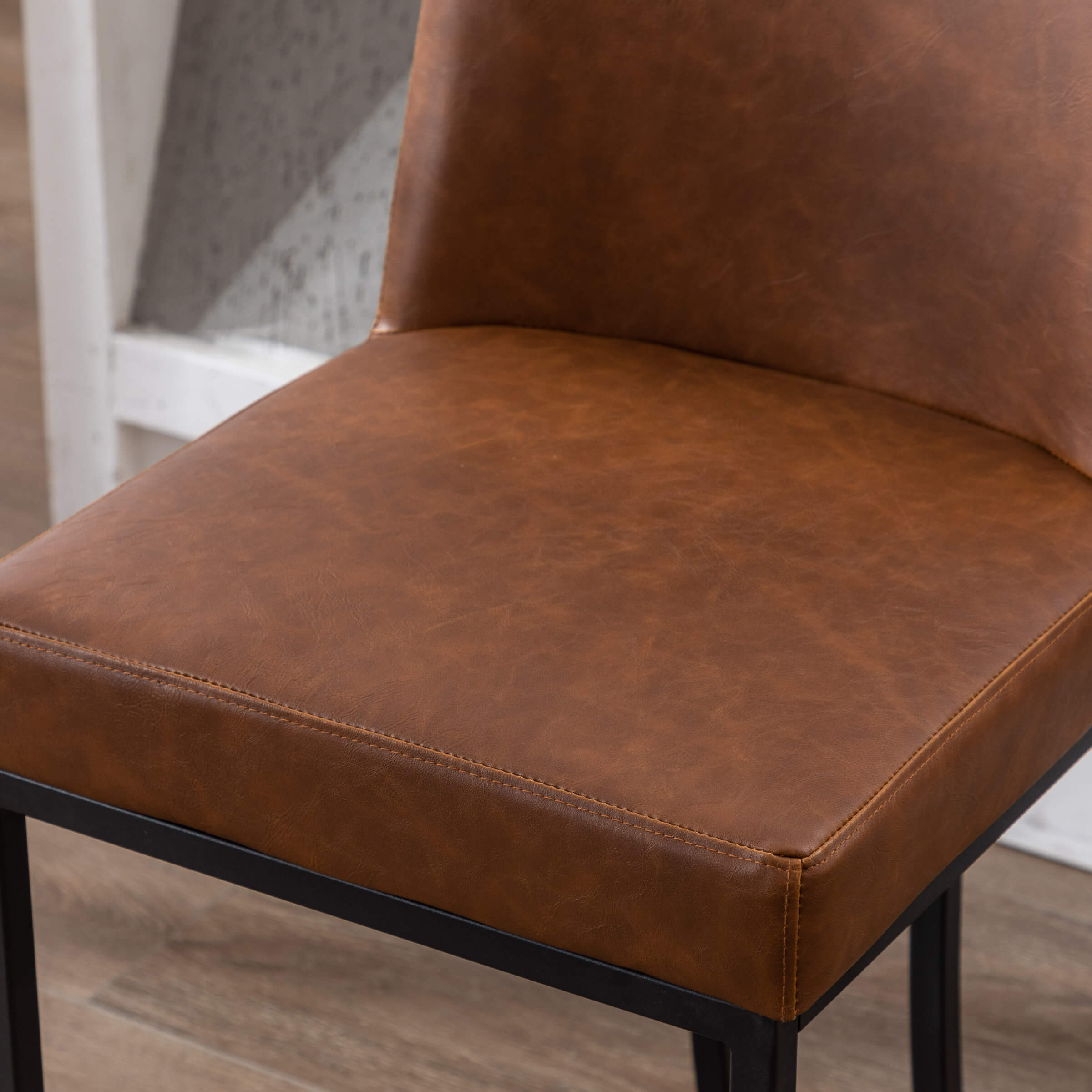 Brown leather stool seat and frame