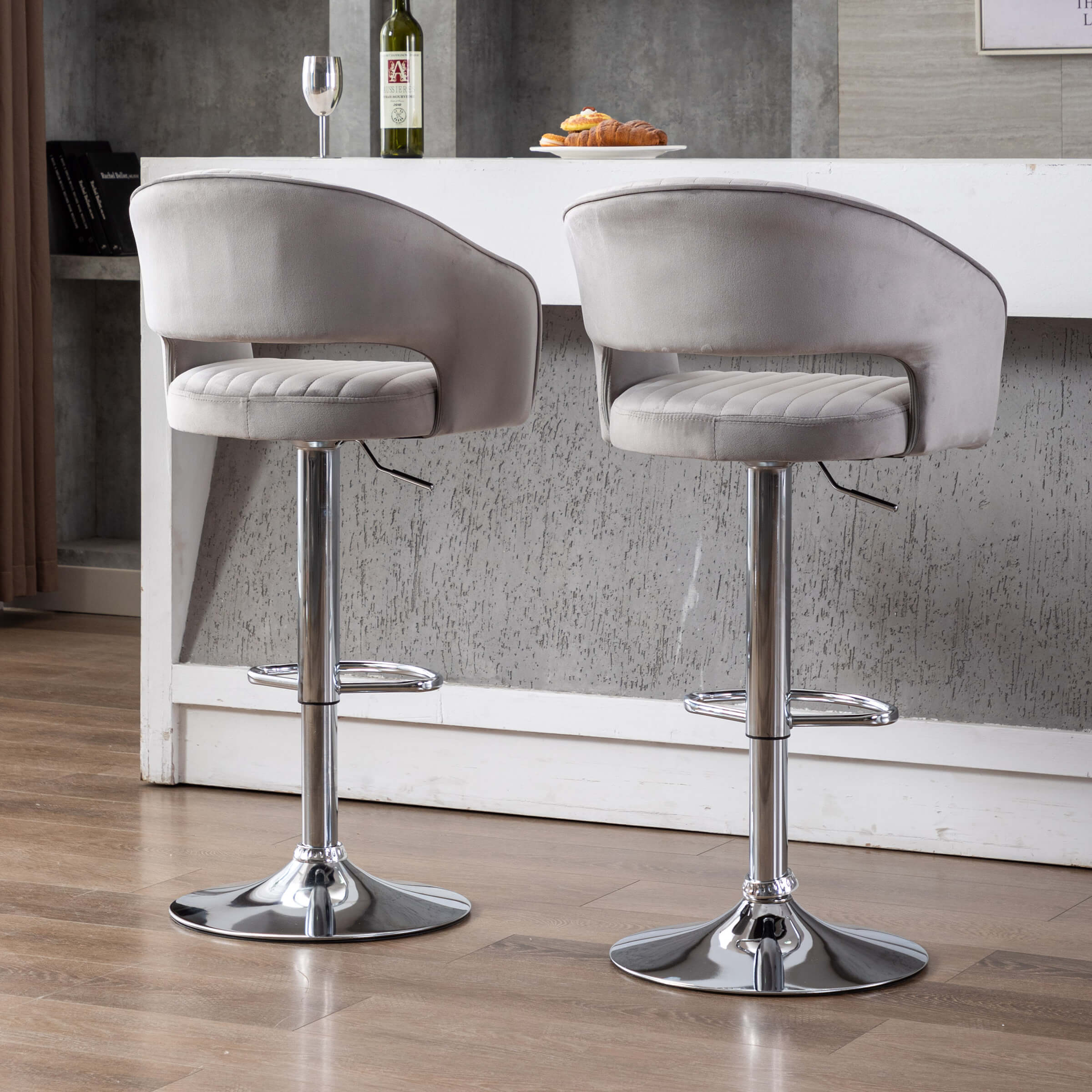 Side view of two grey bar stools at a kitchen counter