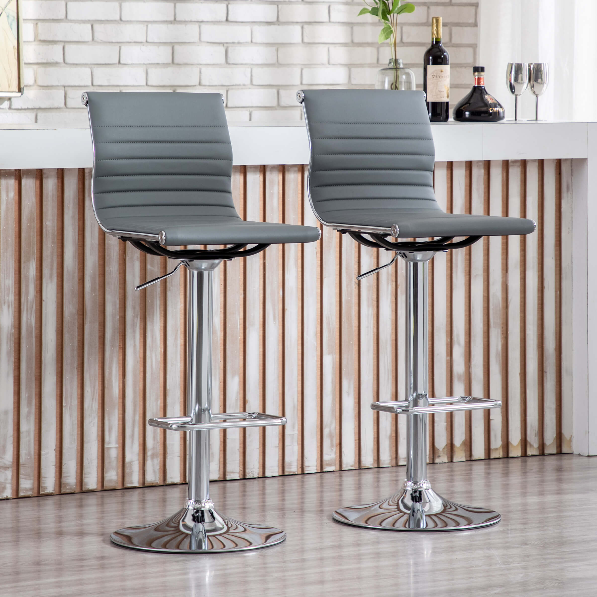 Two stools with white seats at counter