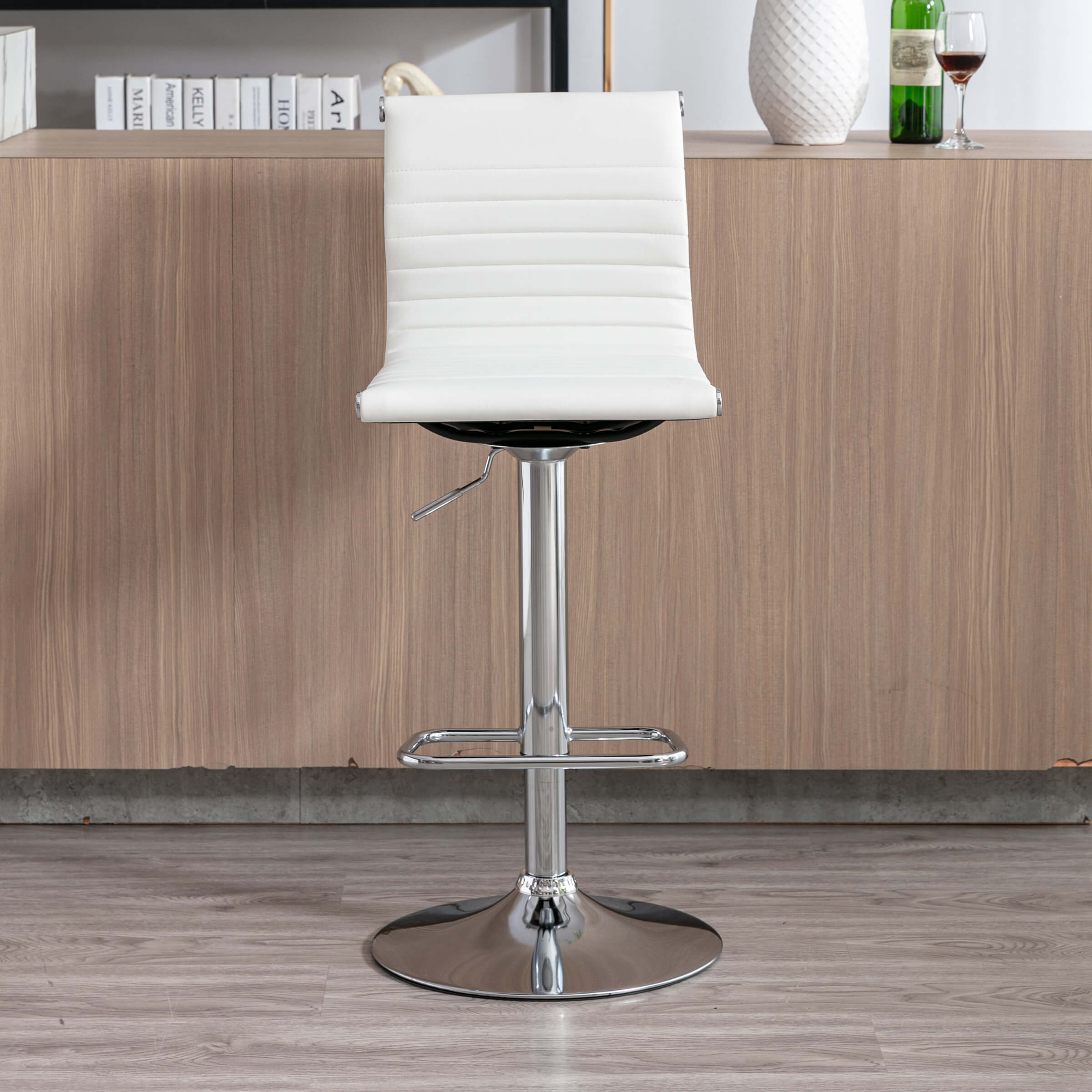 Close-up of white bar stool seat edge showing chrome cap
