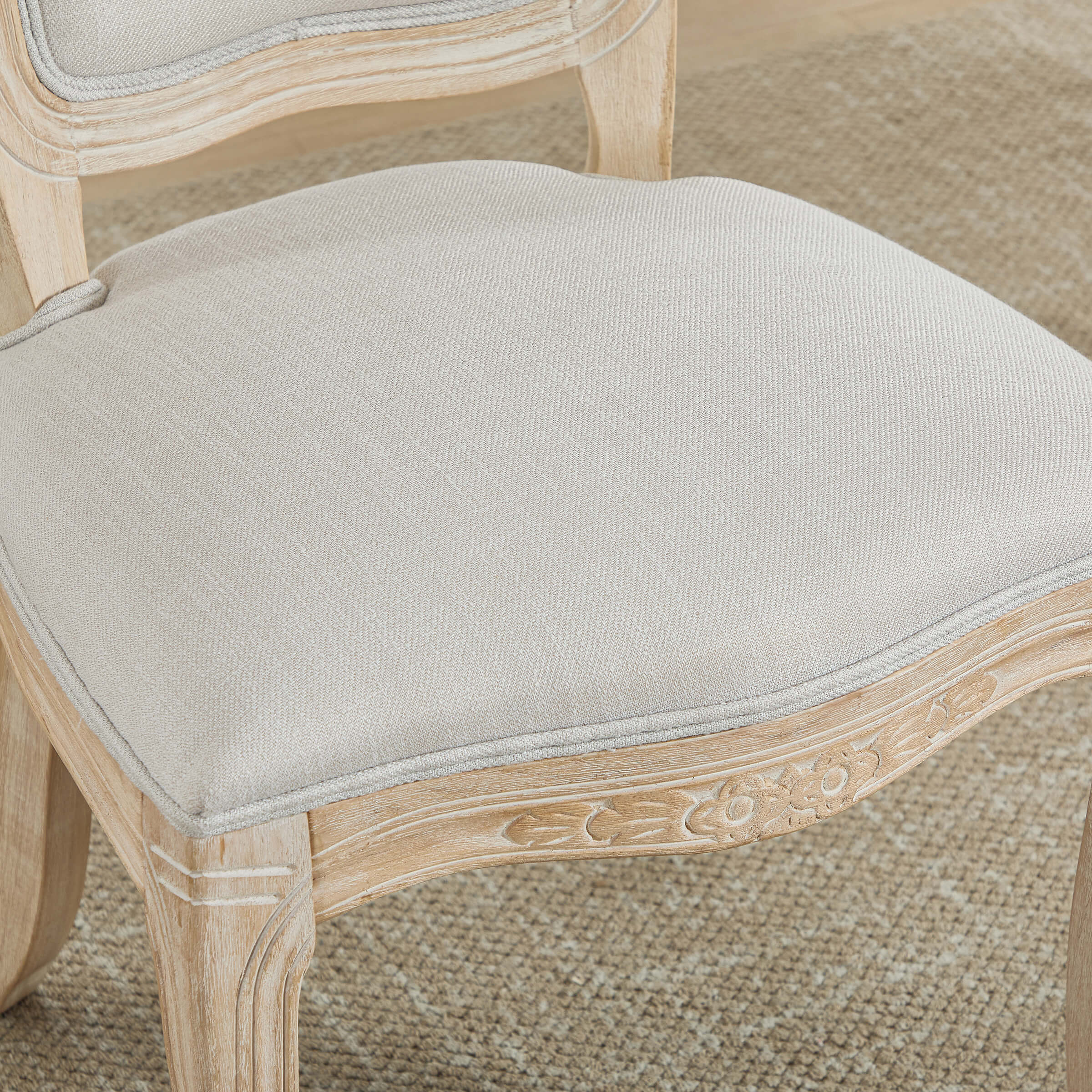 Close-up of chair seat edge and upholstery
