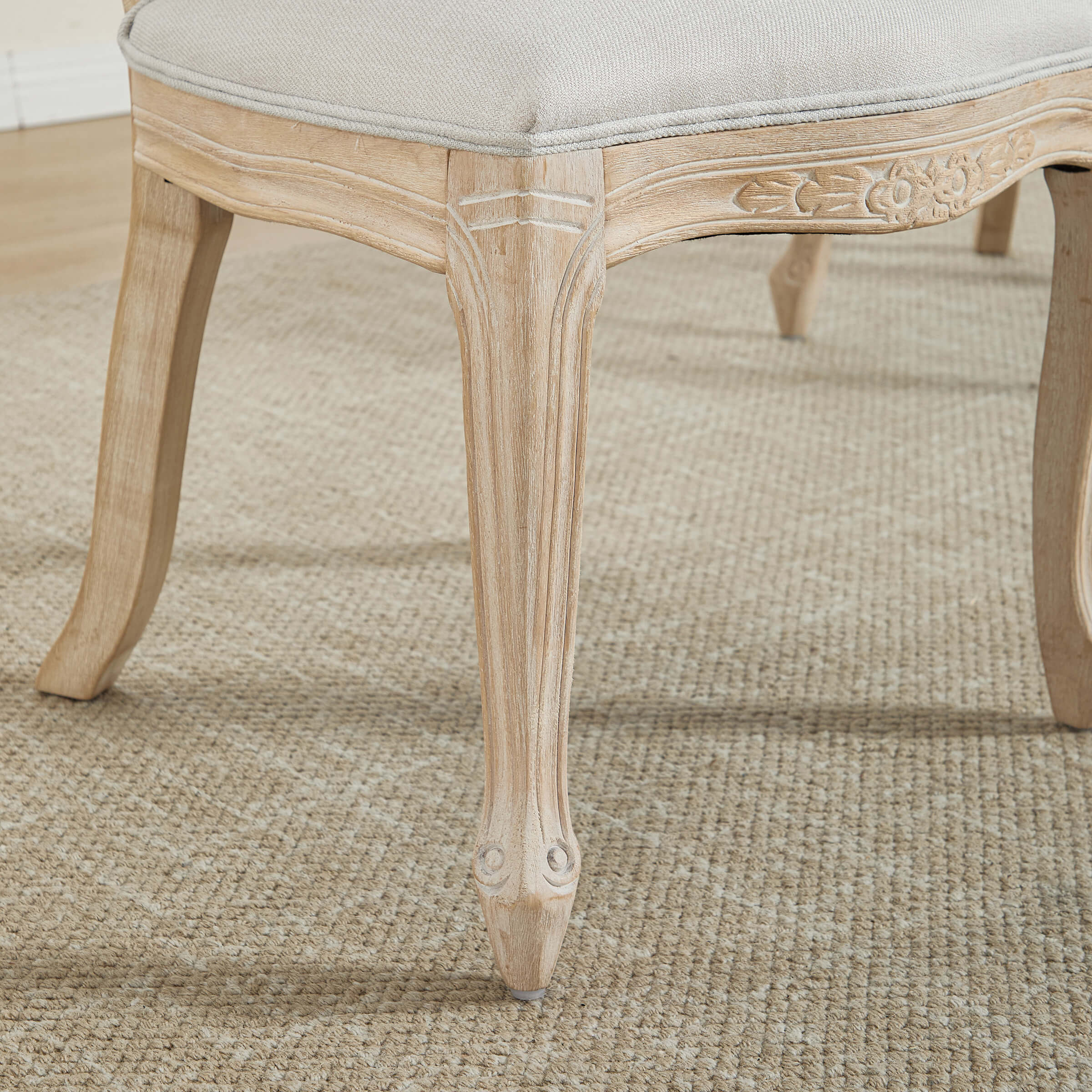 Chair leg with carved floral design