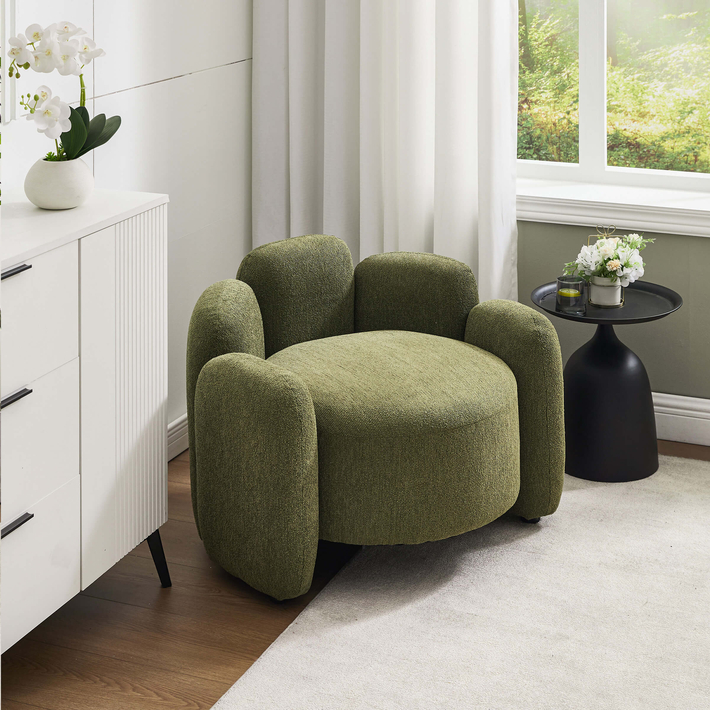 Green chair in a living room with side table