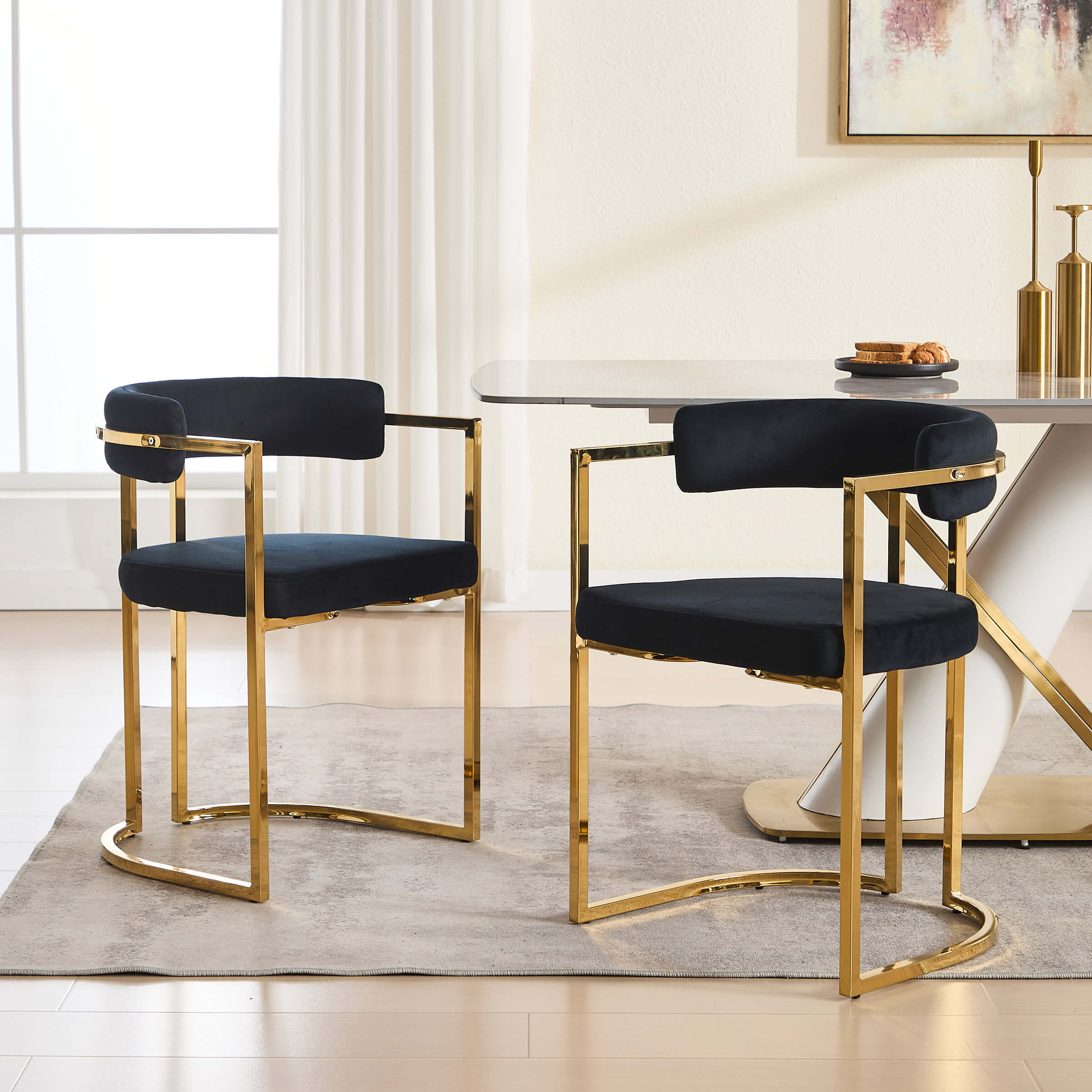 Two navy chairs at a dining table in a sunny room