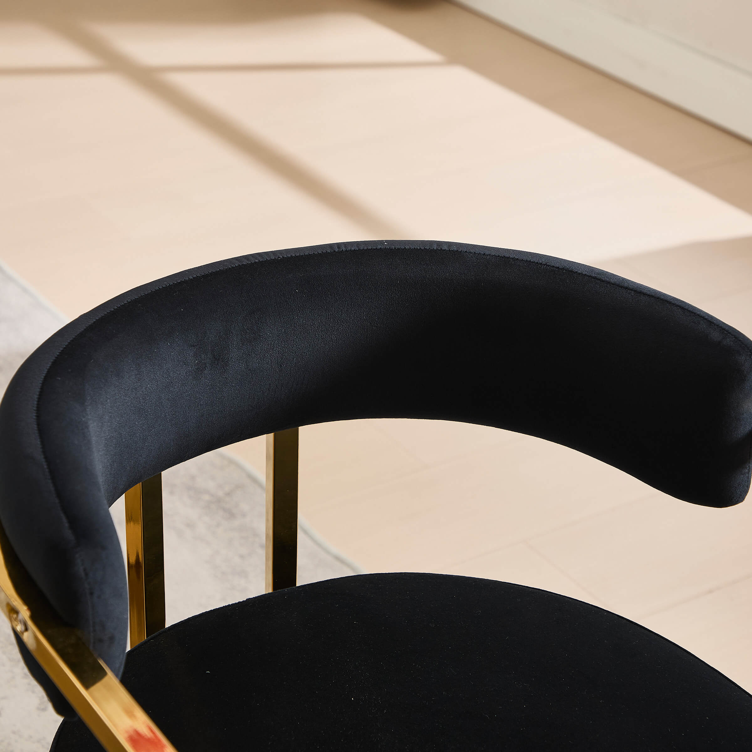 Close-up of navy velvet chair seat