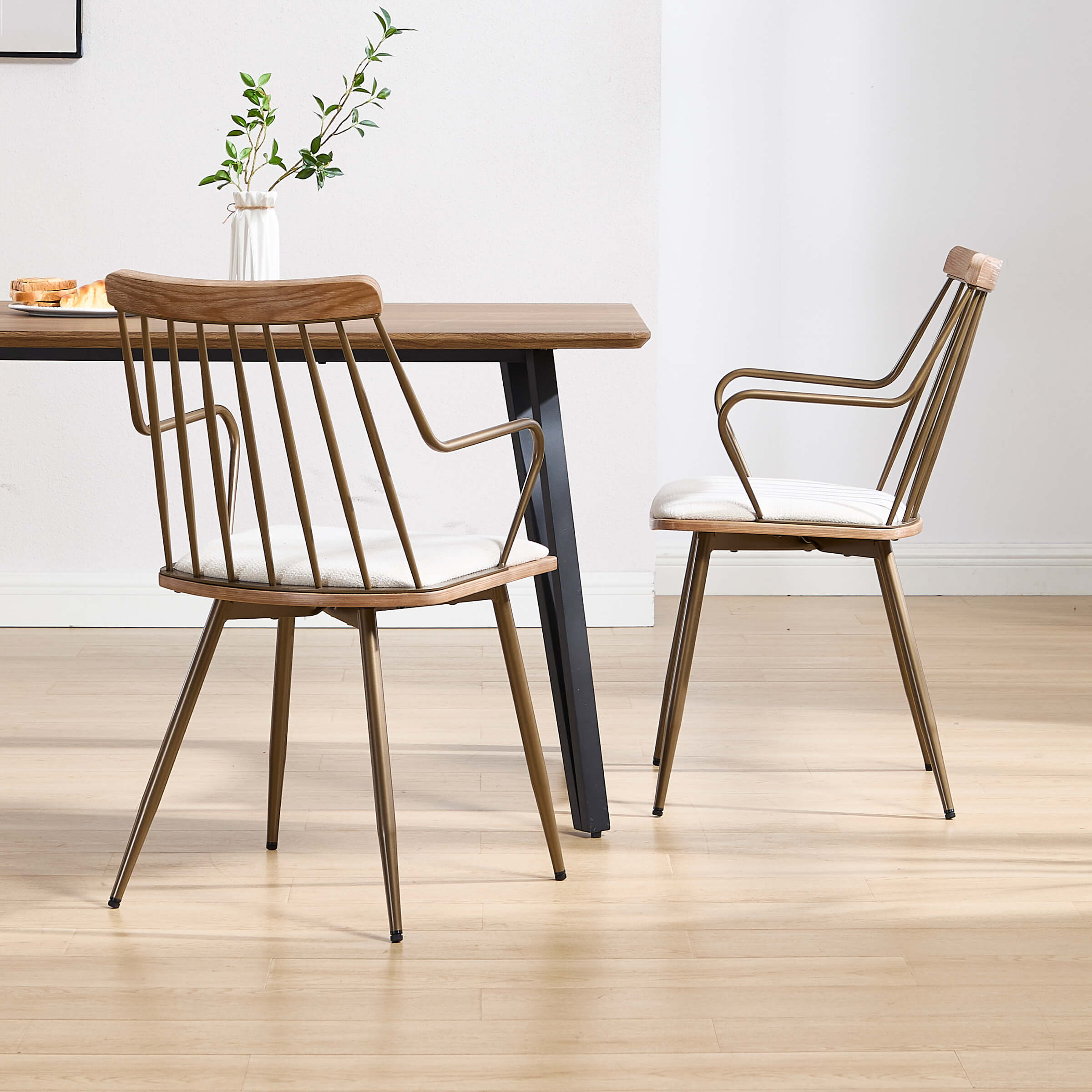 Dining set with two spindle-back chairs around a wooden table