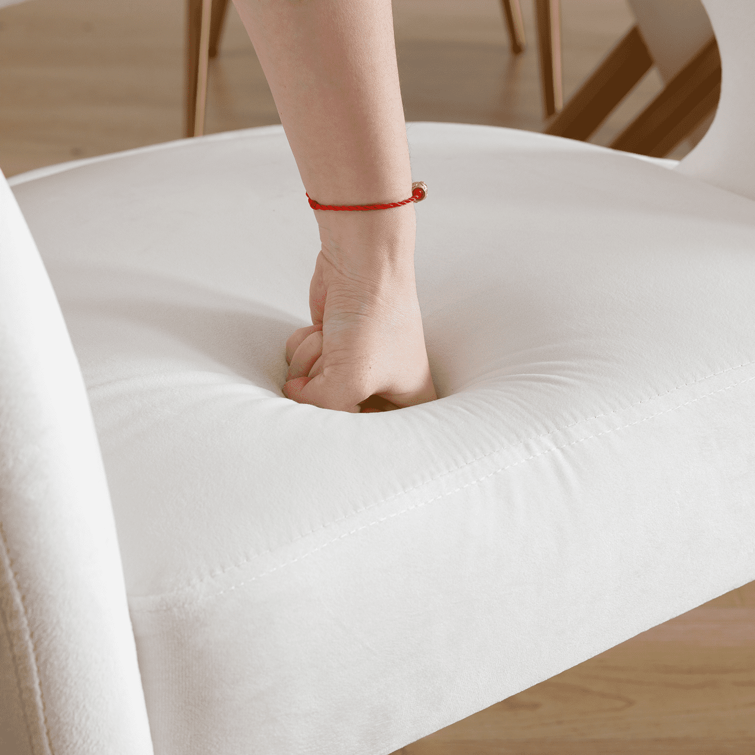 Close-up of seat with hand pressing