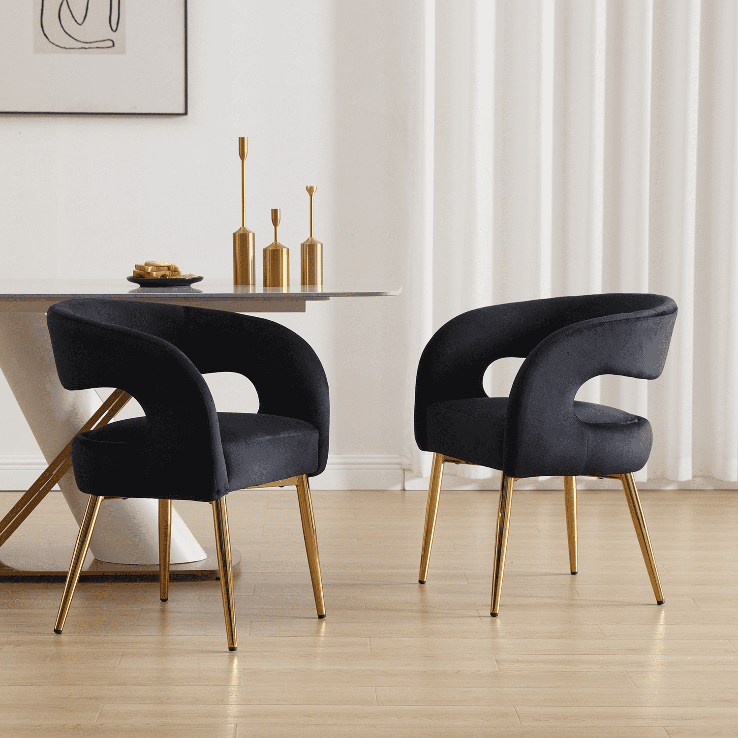 Two black chairs around table